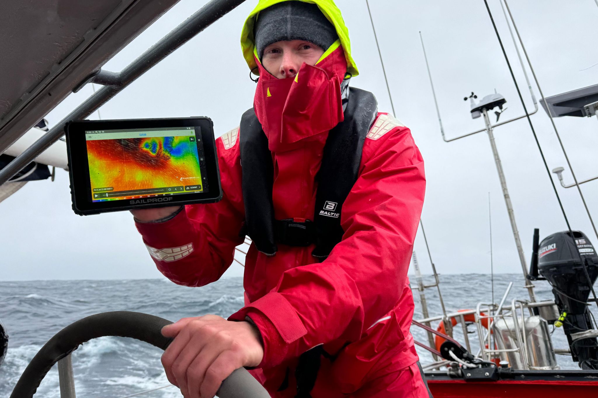 Alex displays a satellite forecast showing harsh weather conditions while sailing the Abel Tasman around Cape Farewell on the southern tip of Greenland.