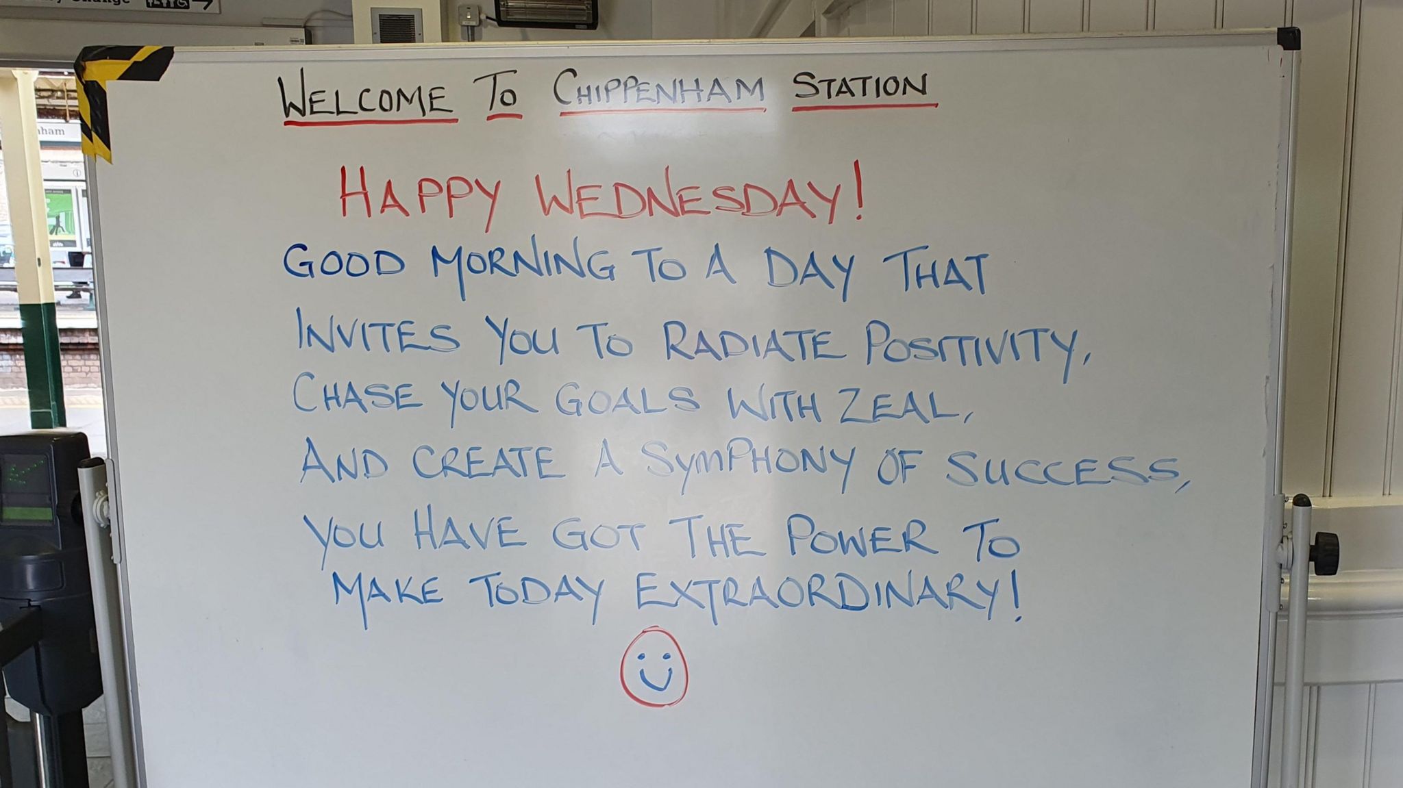 A whiteboard message board that says Welcome to Chippenham Station, along with a positive quote for Wednesday