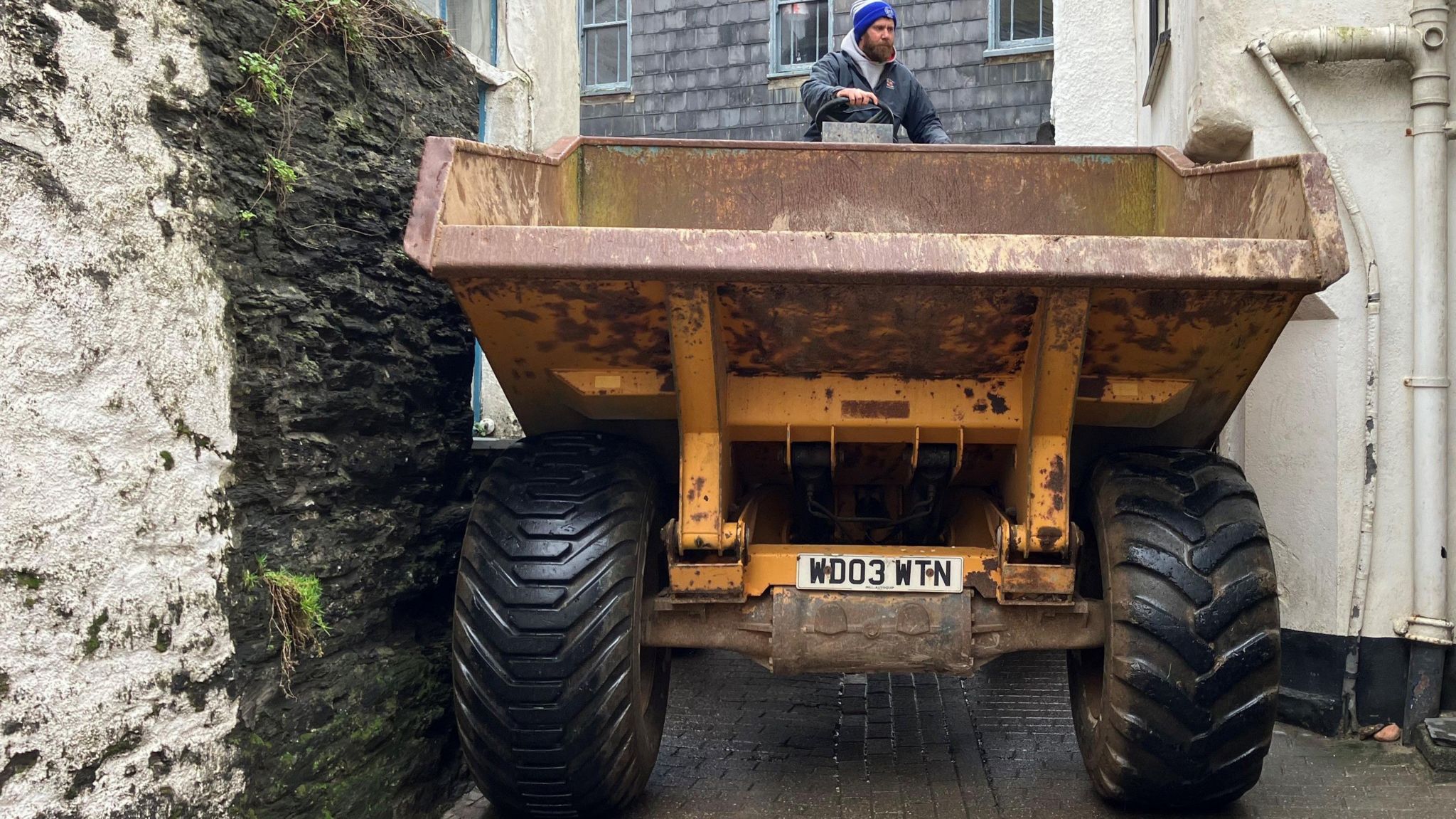 Dumper being squeezed down Port Isaac street