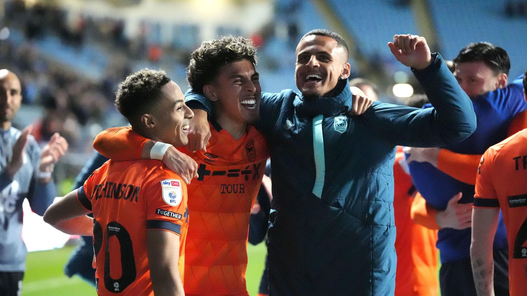 Ipswich Town's Omari Hutchinson (left) and team-mates celebrate victory after the final whistle against Coventry