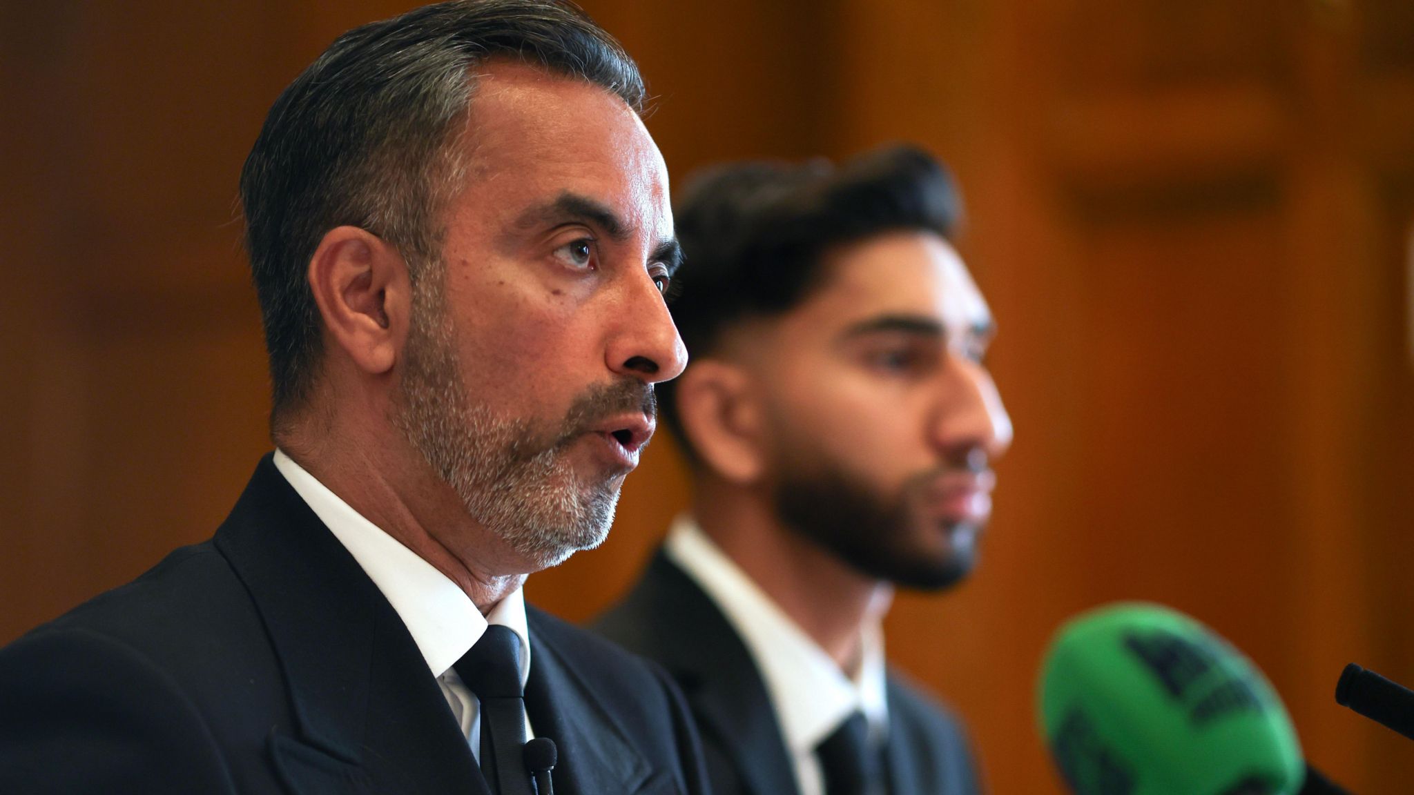 British human rights lawyer Aamer Anwar (L) speaks next to Fahir Amaaz, one of the two brothers involved in the Manchester Airport incident, during a press conference at the Midland Hotel in Manchester, Britain, 06 August 2024.