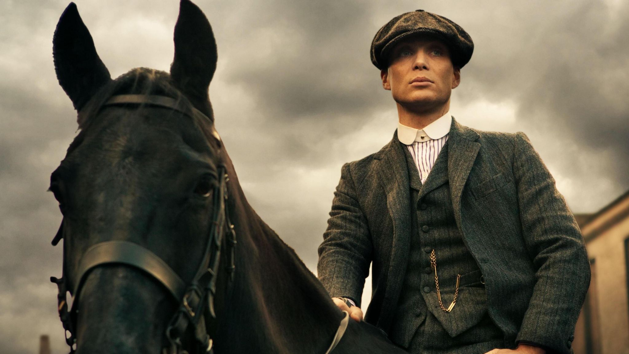 Cillian Murphy sits on a horse in the TV show Peaky Blinders