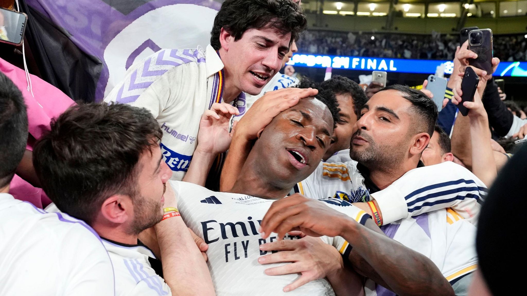 Real Madrid's Vinicius Jr celebrates with the fans after winning the UEFA Champions League final 