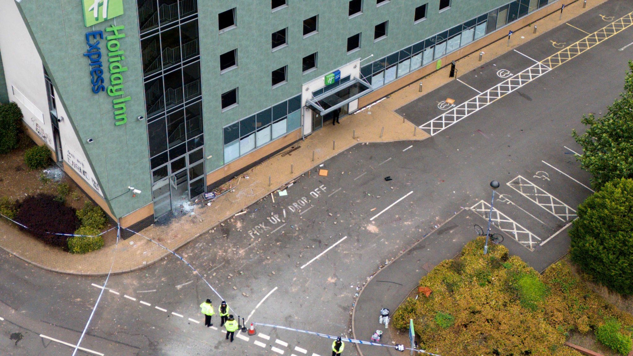 An aerial view of the Holiday Inn Express hotel with a police cordon