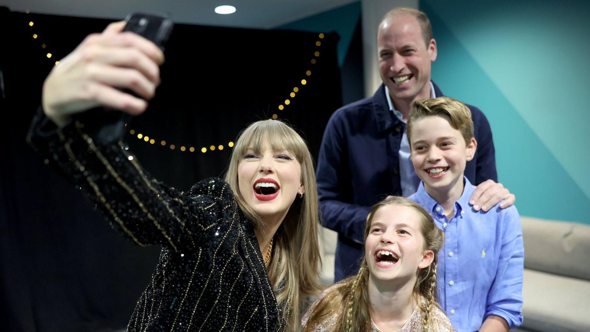 A picture of Taylor Swift with Prince William, Prince George and Princess Charlotte