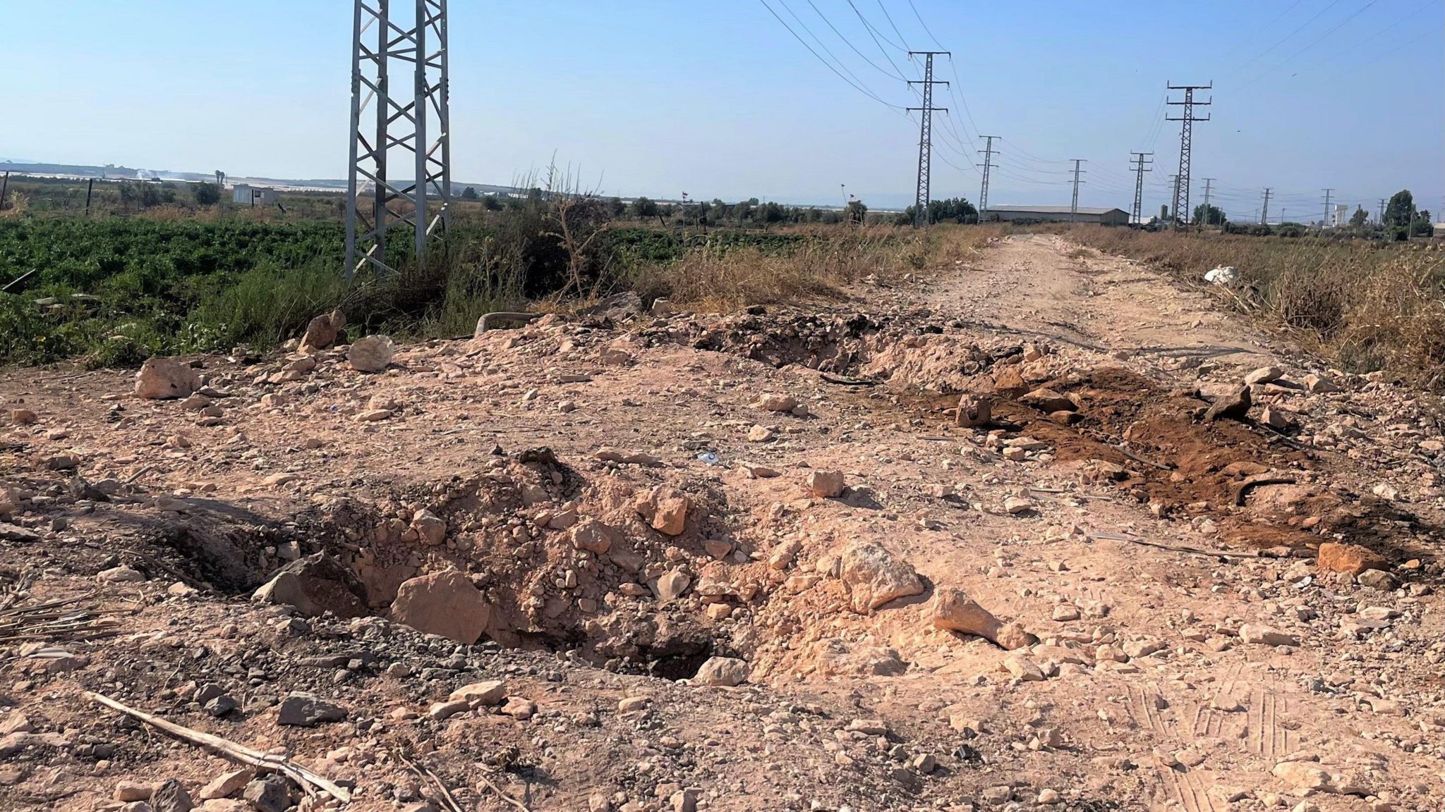 Craters from two bombs cut across a road near Jenin. The bombs hit two Israeli units.