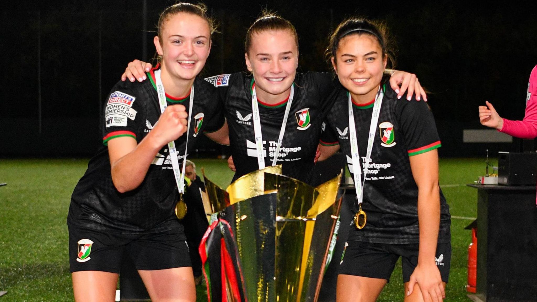 Kerry Beattie, Emily Wilson and Joely Andrews pose with the Women's Premiership trophy