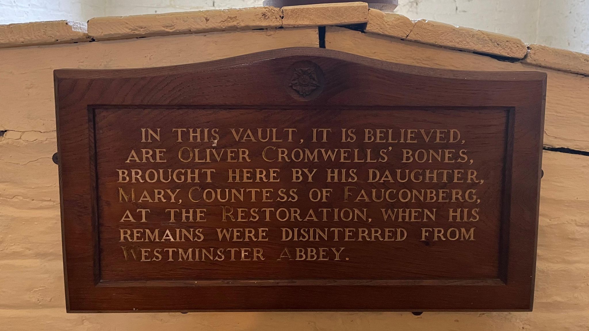 A wooden sign explaining the contents of a vault