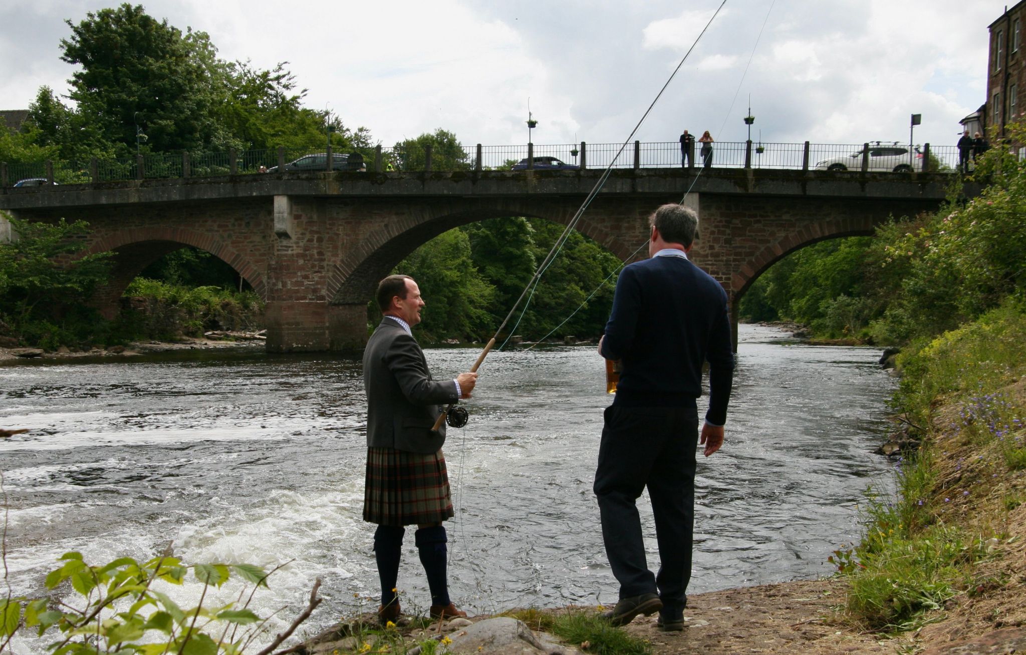 Jamie Macpherson of Macpherson Fishing takes the first ceremonial cast after the stretch of river was handed over