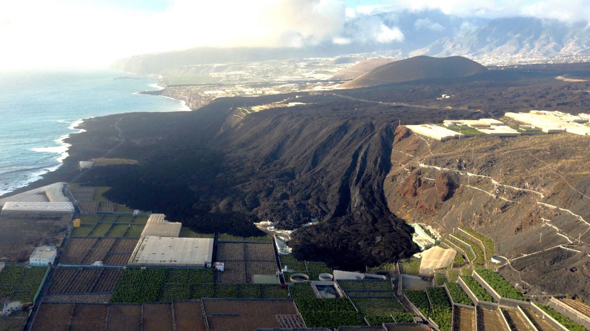 A lava flow covers farmland in La Palma