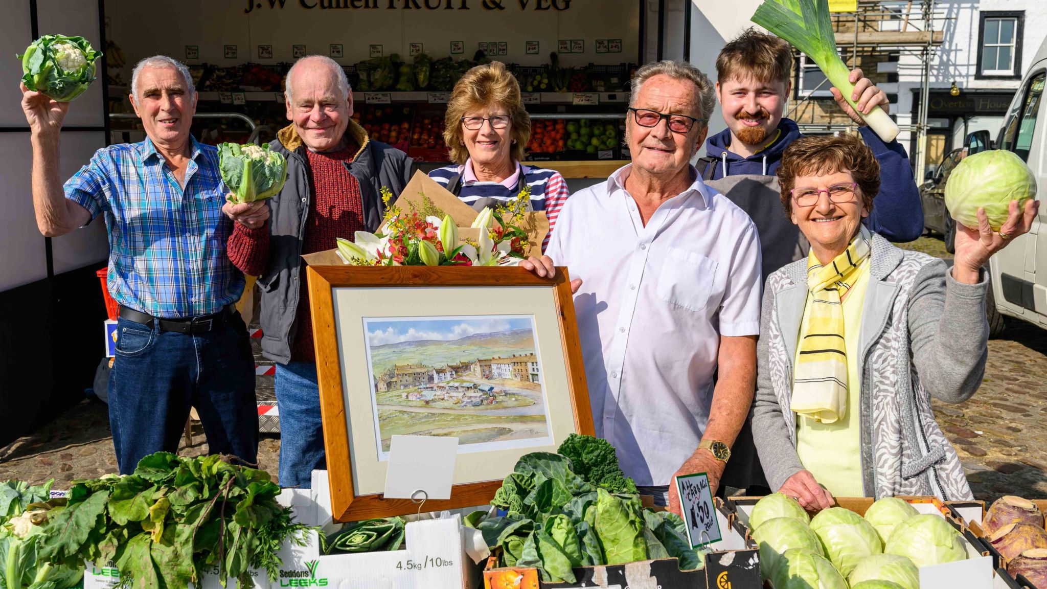 Mr Garner with friends and family at his Reeth Market stall