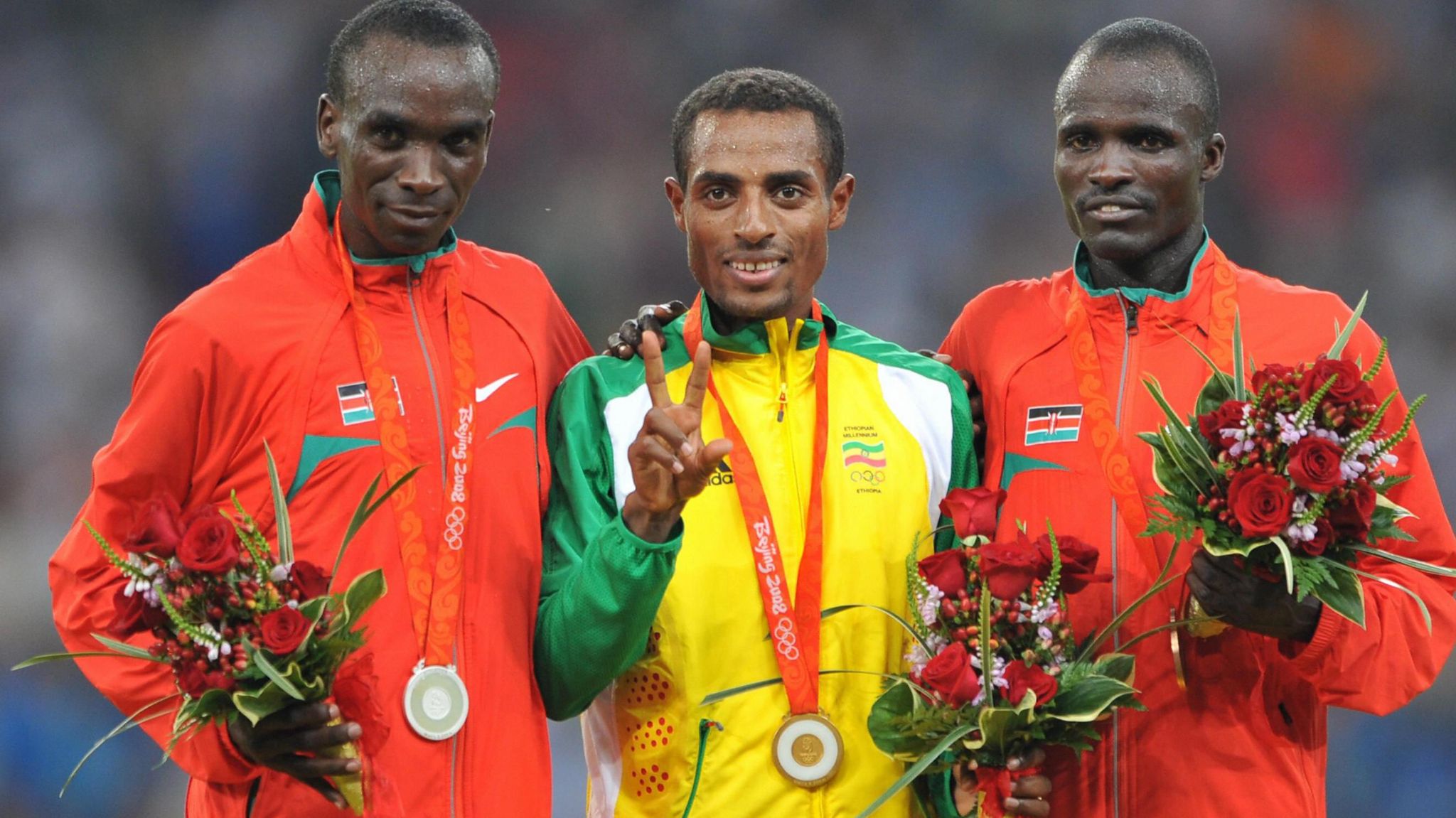 Kenya's Eliud Kipchoge, Ethiopia's Kenenisa Bekele and Kenya's Edwin Cheruiyot Soi pose on the podium during the medal ceremony for the men's 5000m at the Beijing 2008 Olympic Games