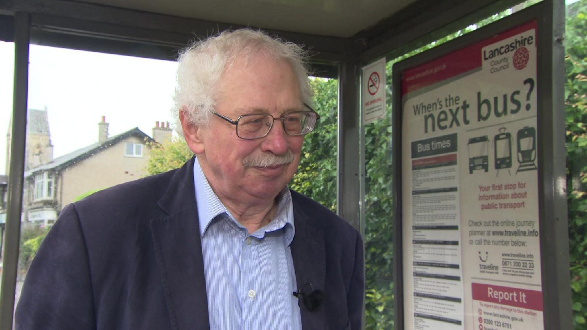 Jim Davies at a bus stop shelter