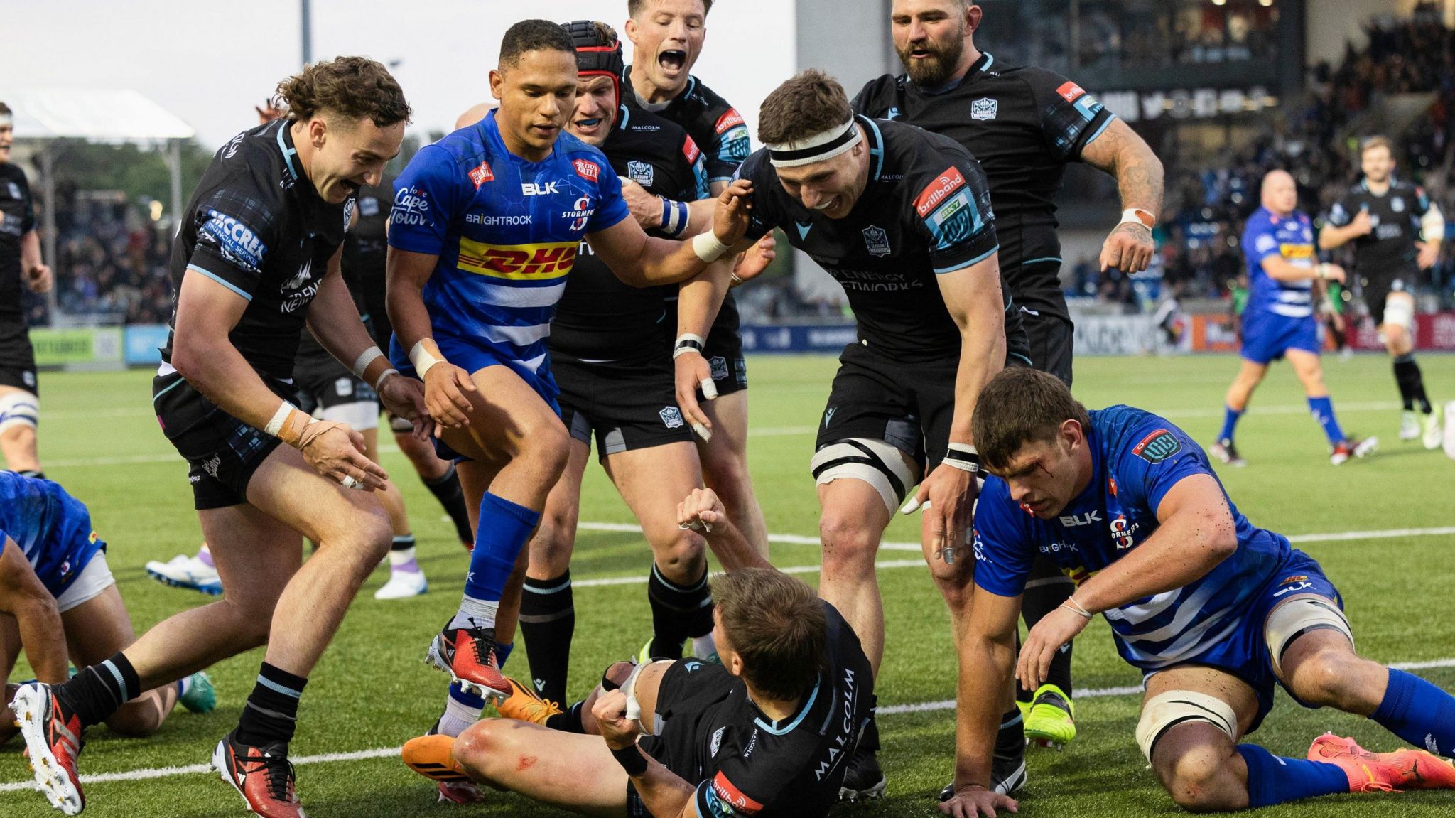 Glasgow Warriors celebrate Sebastian Cancelliere's try