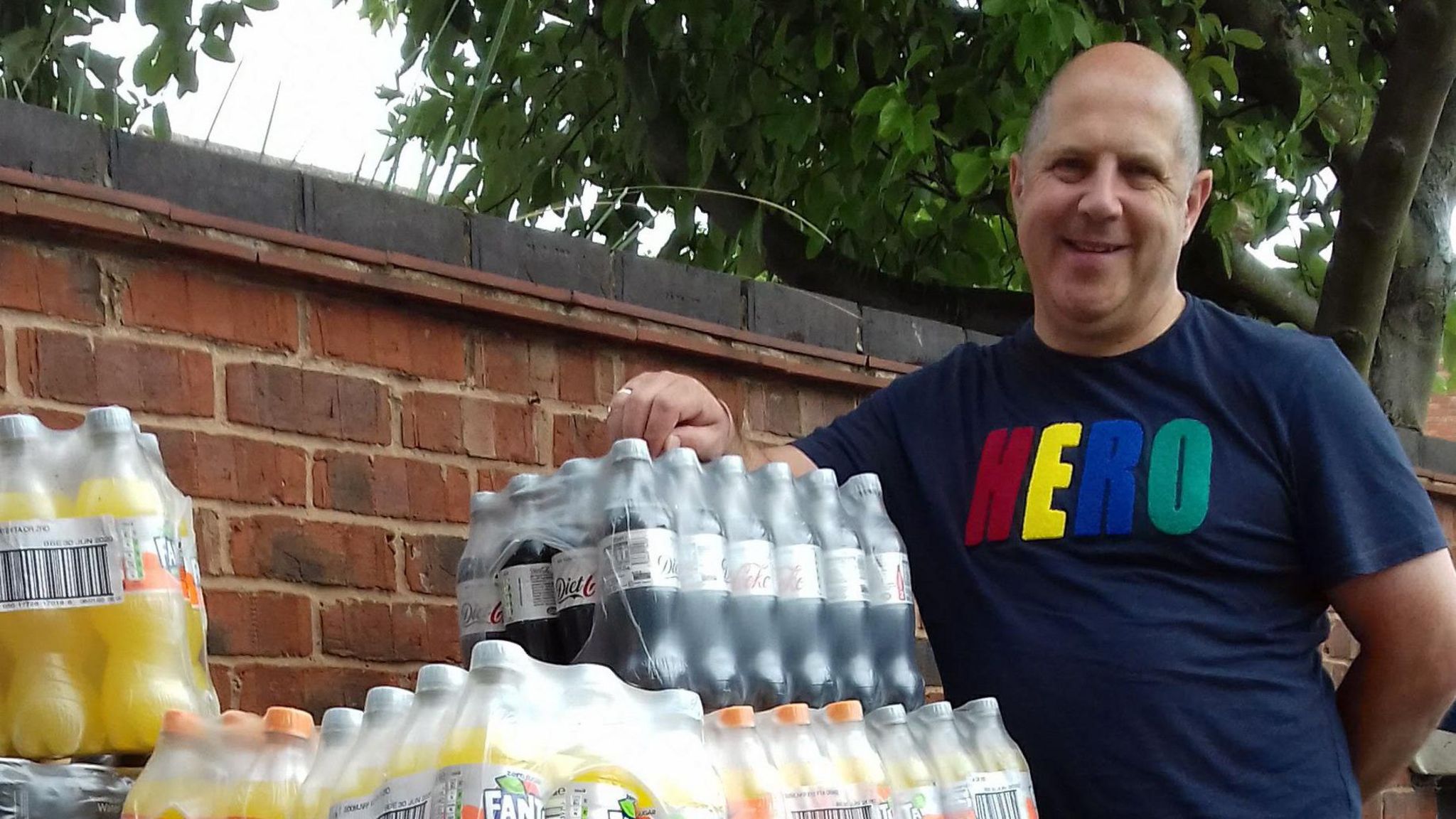 John McGall with bottles of pop