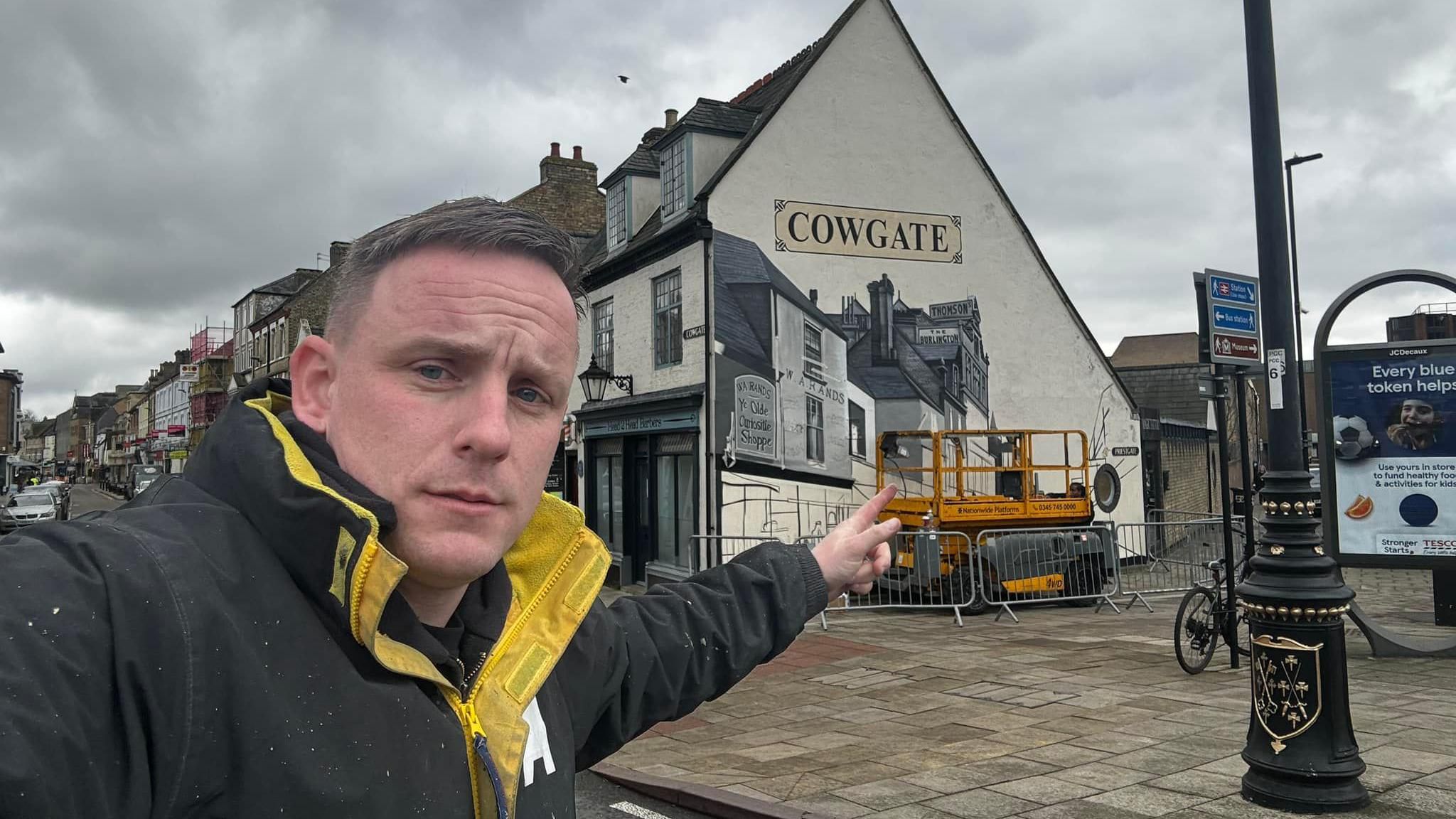 Nathan selfie in front of the Cowgate Mural