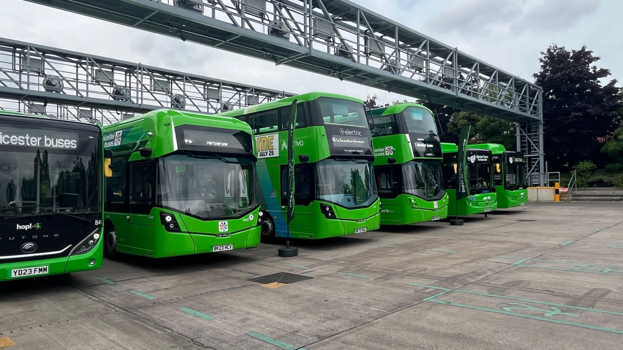 Electric buses lined up in a depot in Leicester