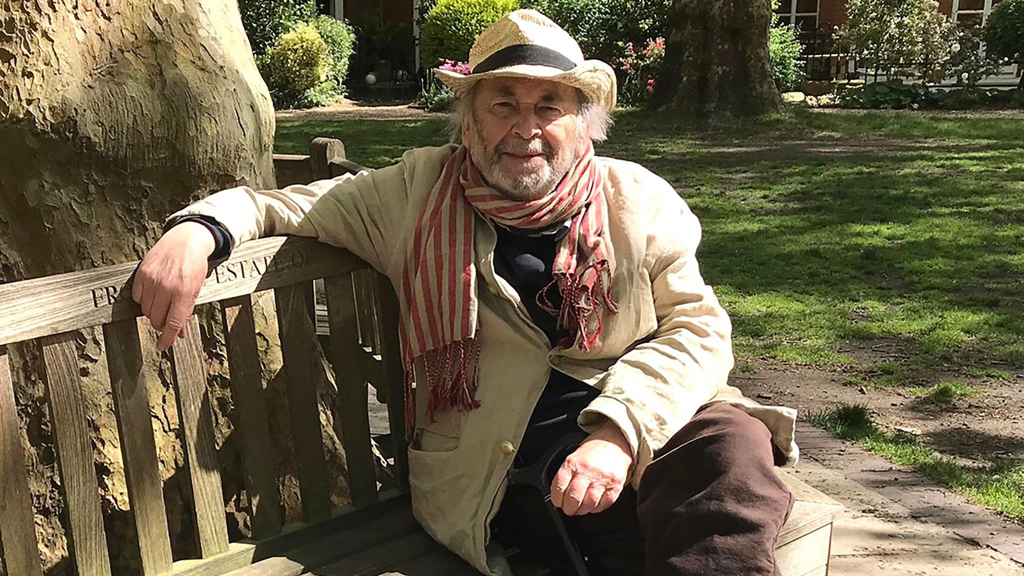 Quentin Blake sitting on a bench