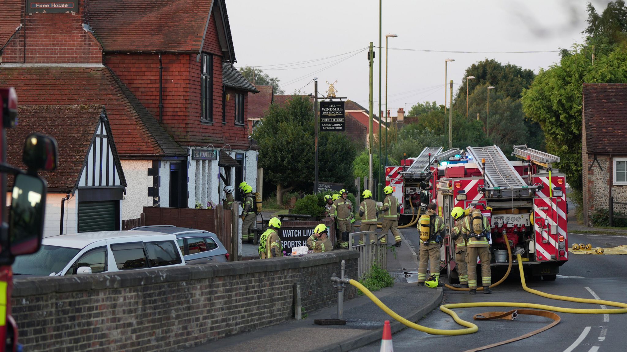 Firefighters outside the pub