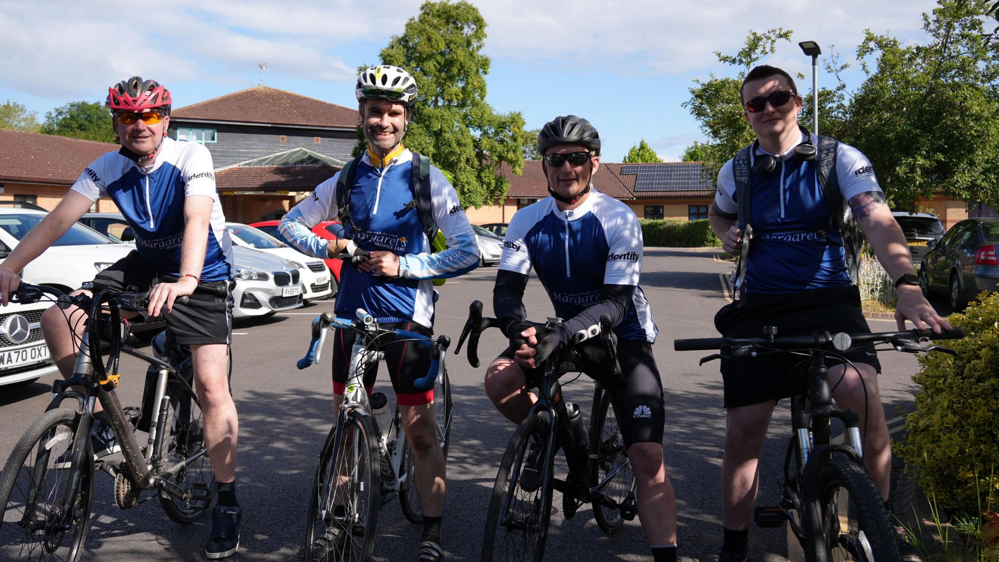 Four from St Margaret's Hospice cyclists lined up in a row