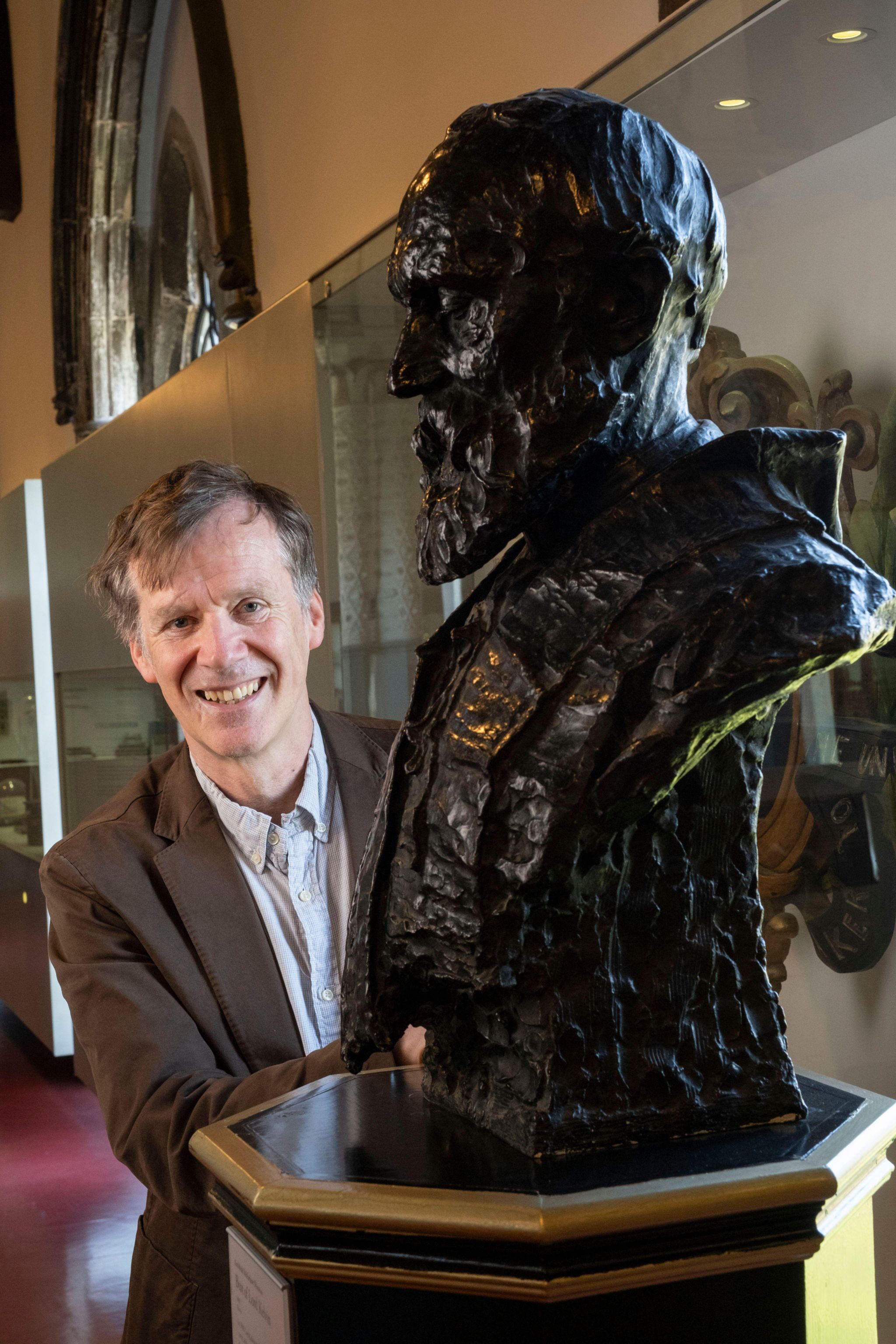 Professor Miles Padgett with a bust of Lord Kelvin