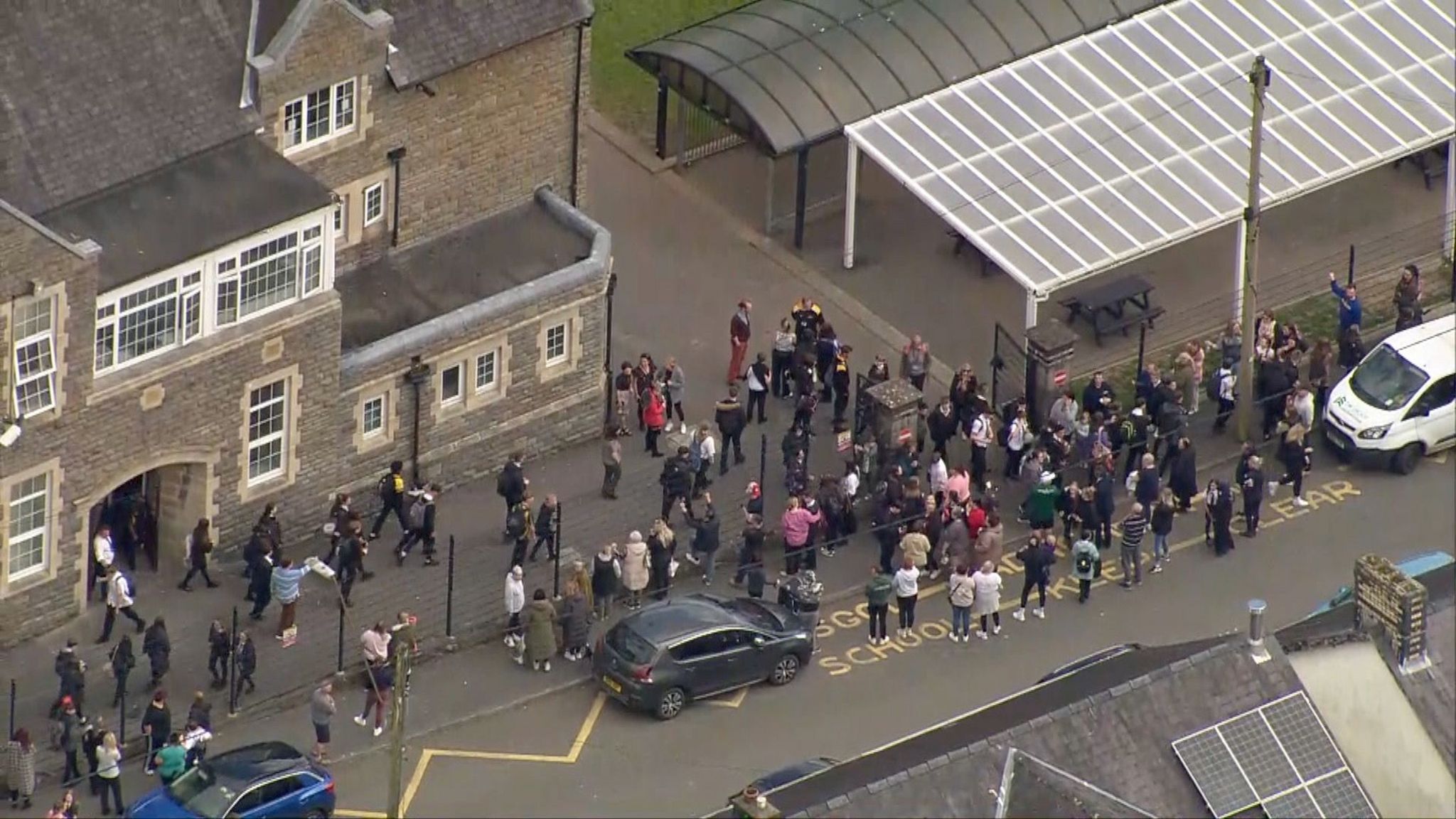Lines of children leaving the school after the lockdown ended