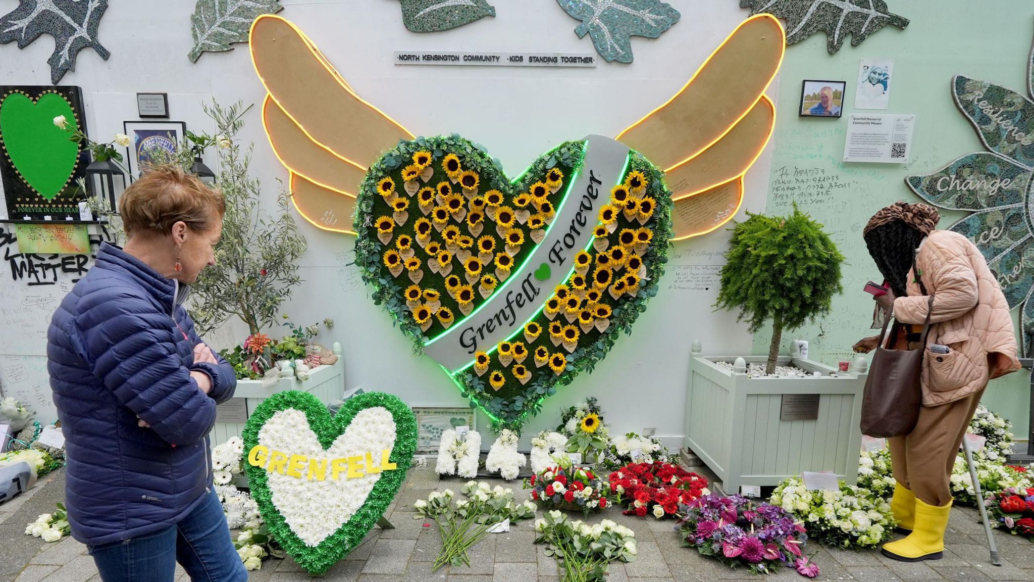 The memorial at the base of Grenfell Tower
