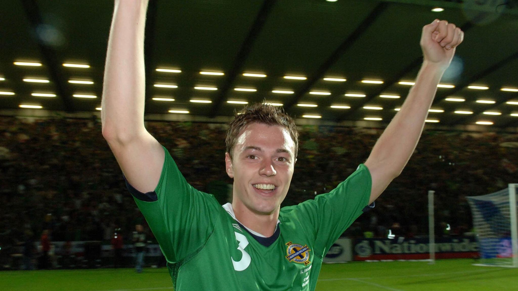 Jonny Evans celebrates Northern Ireland's win over Spain at Windsor Park in 2006