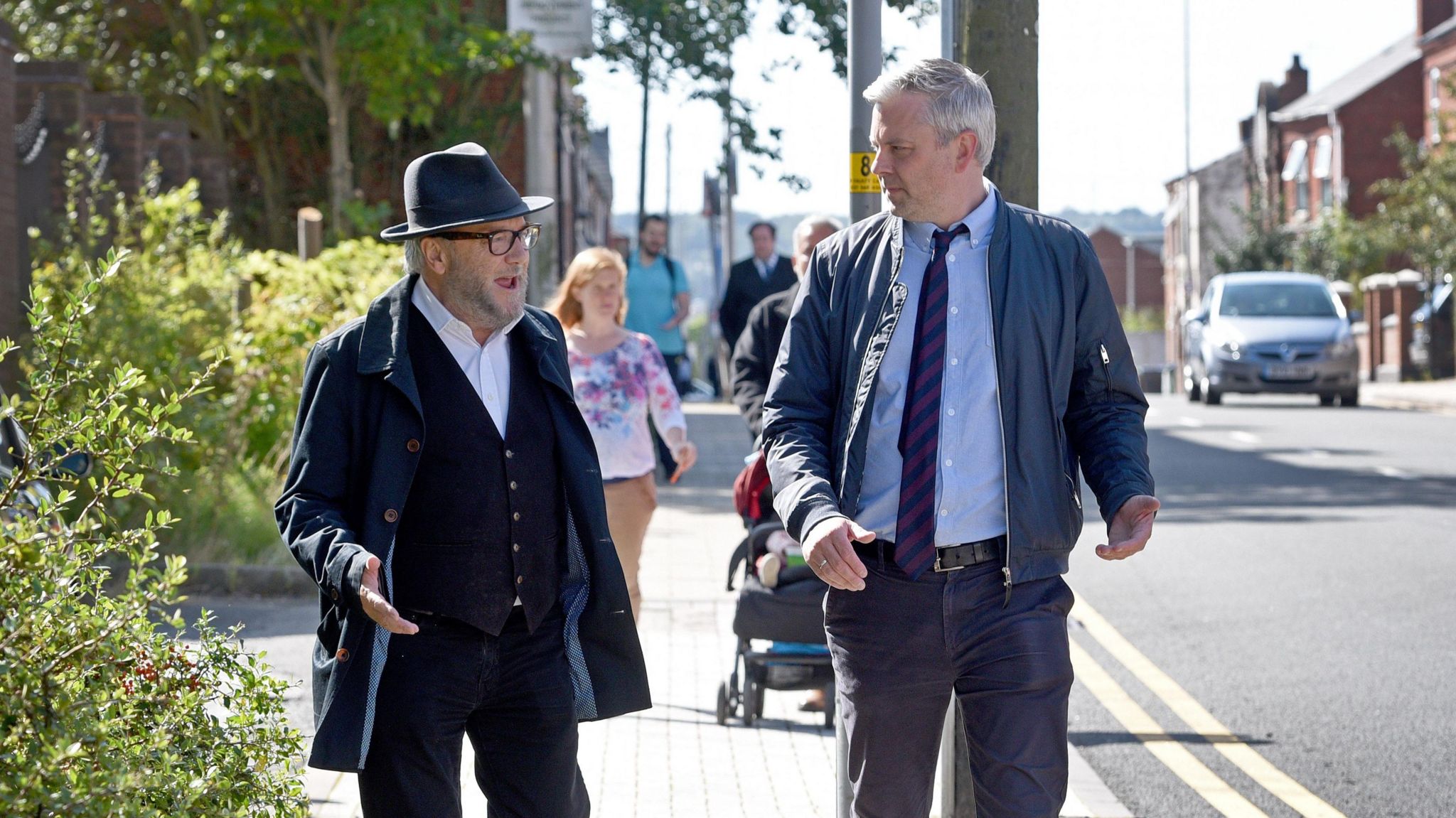 George Galloway walking with Peter Madeley