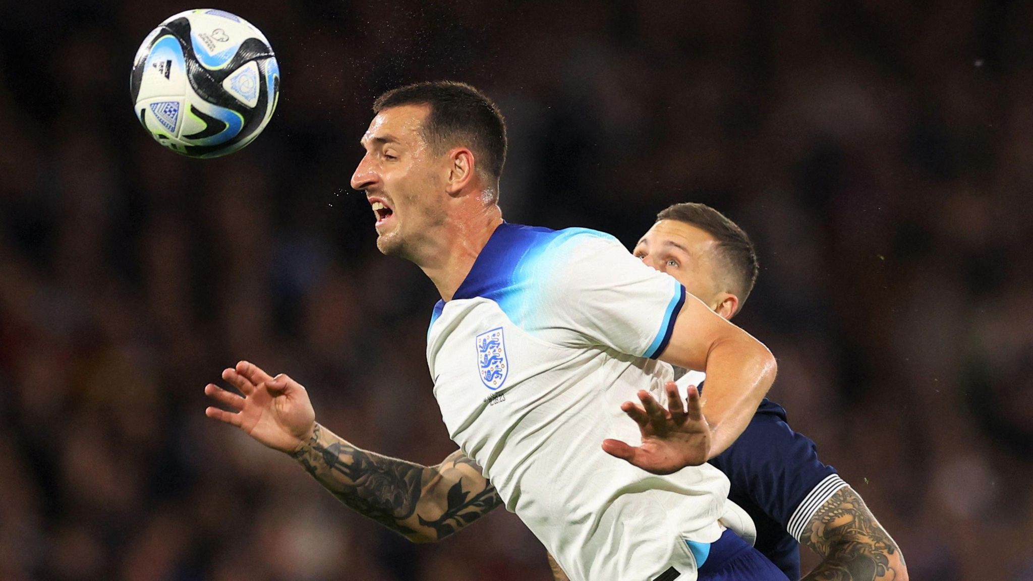 Lewis Dunk wins a header for England