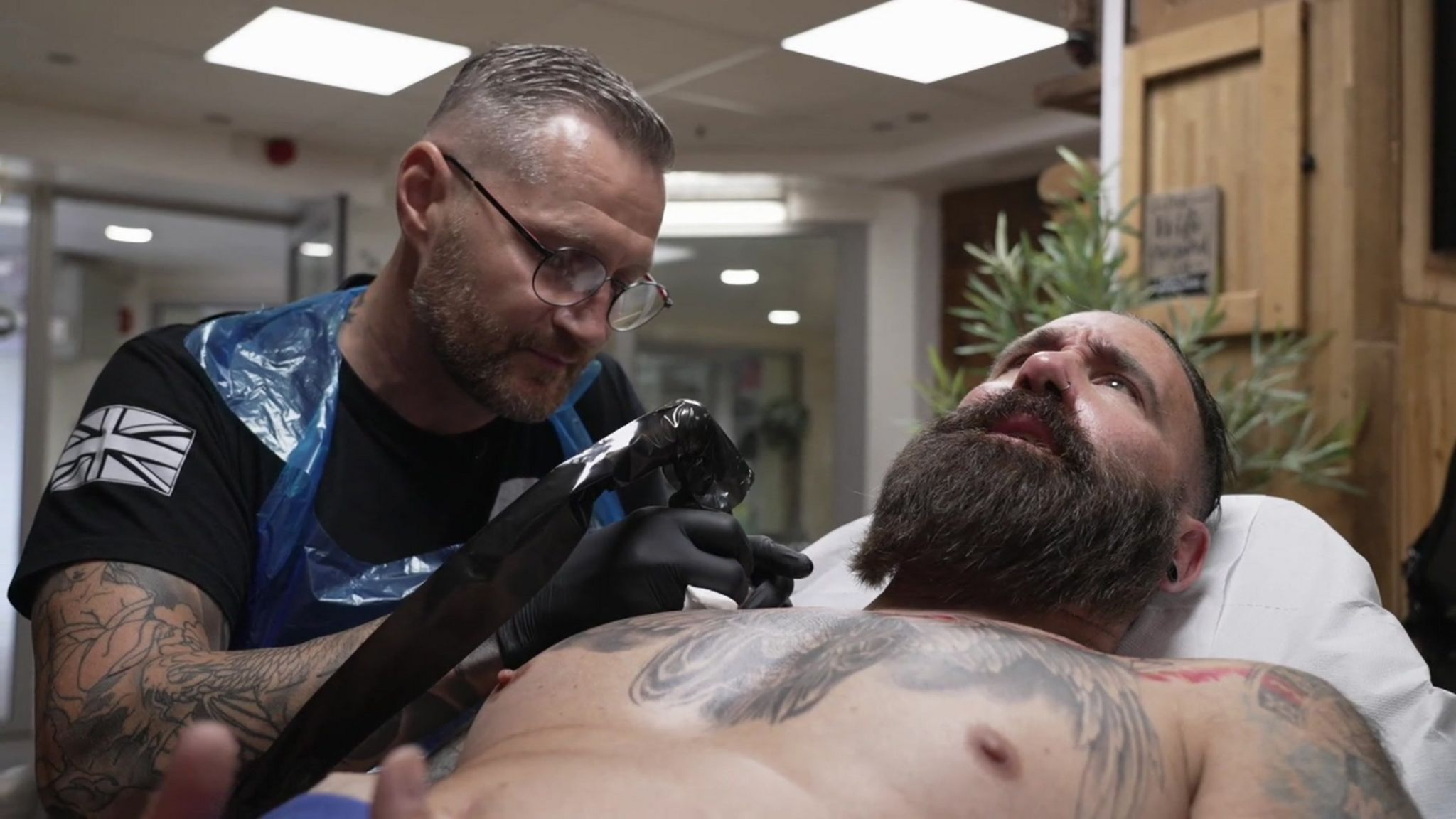 Aaron Baillie tattooing Scott Lovegrove