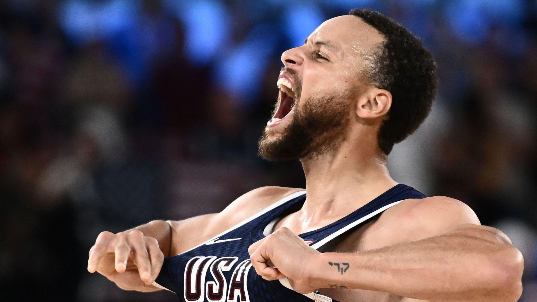 Stephen Curry celebrates scoring for the United States in the Paris 2024 Olympic final