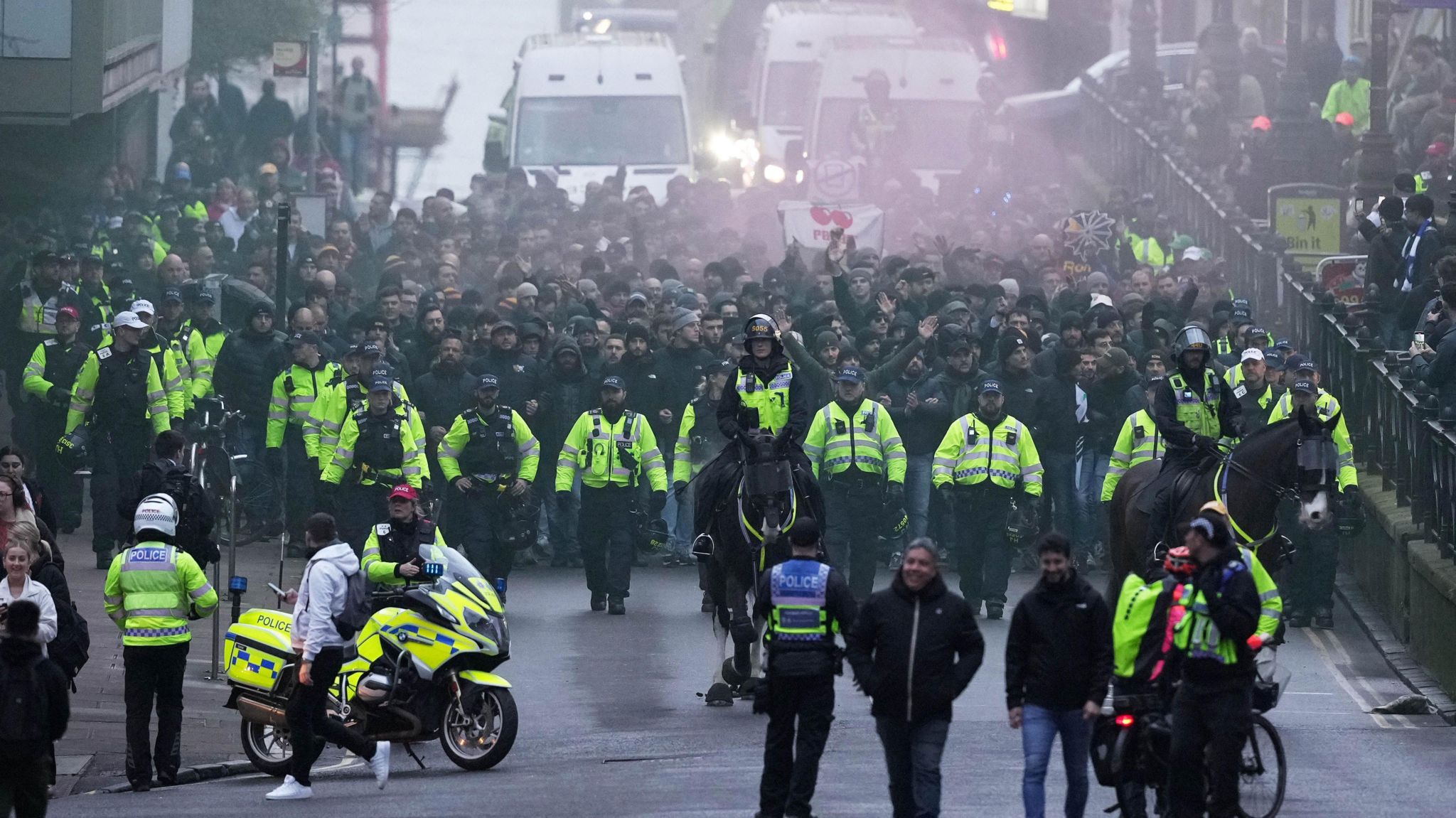 Roma supporters being escorted to the match in Brighton
