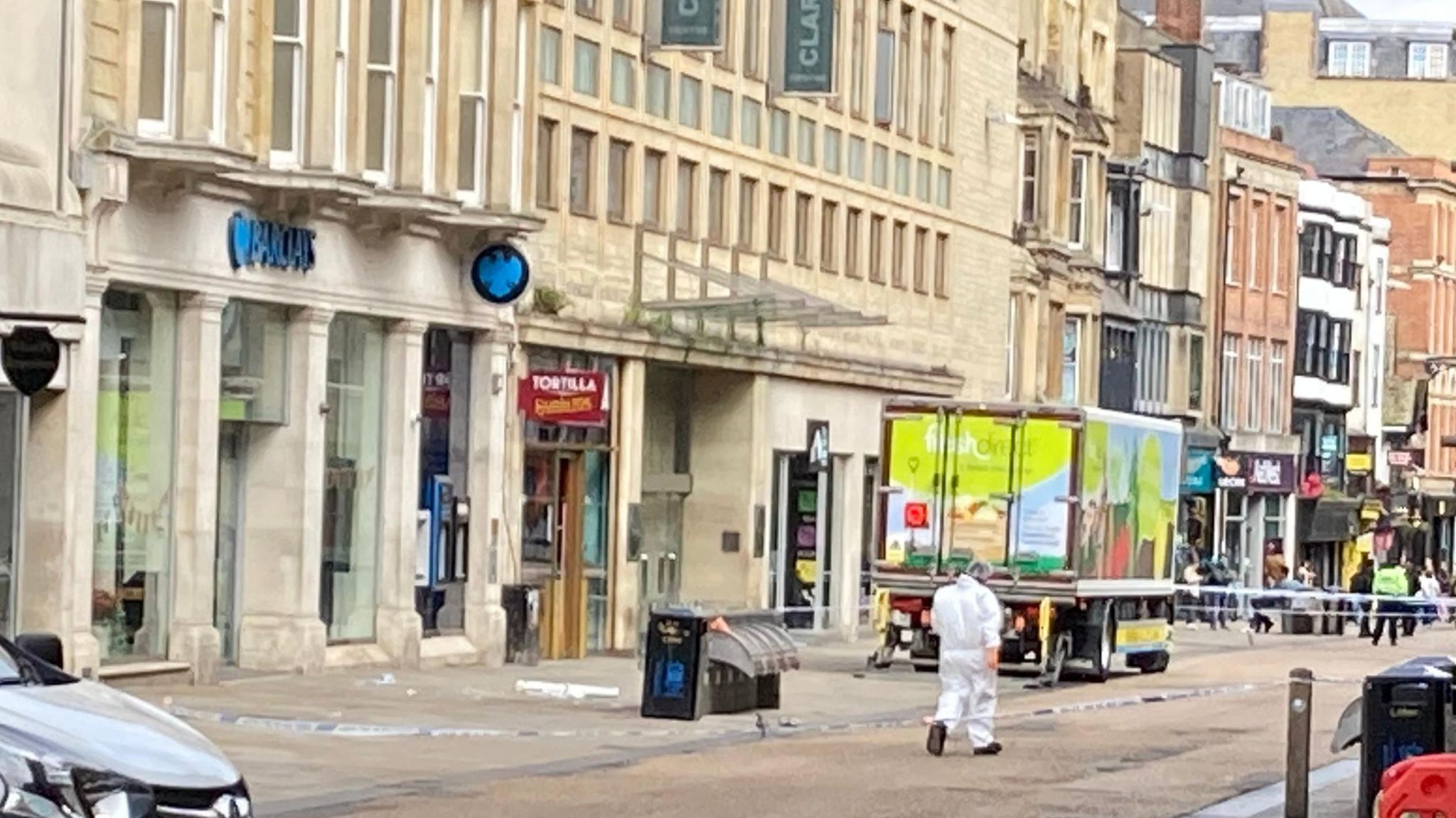 Forensics officers at the scene of a cordoned off Cornmarket Street