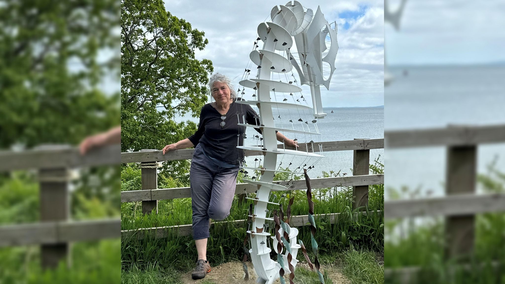 Eilidh Middleton standing next to seahorse sculpture
