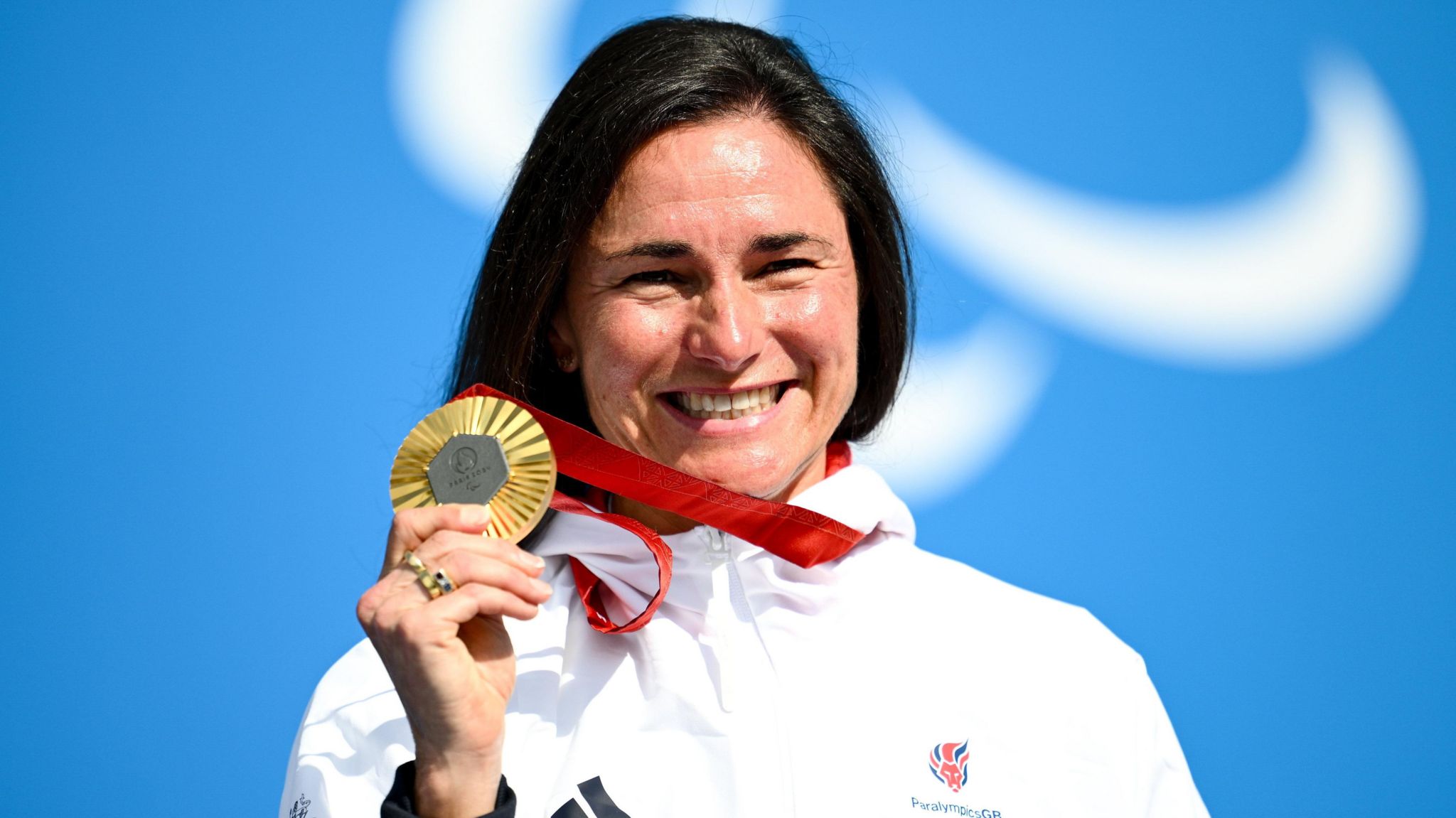 Sarah Storey shows off her latest Paralympics gold medal