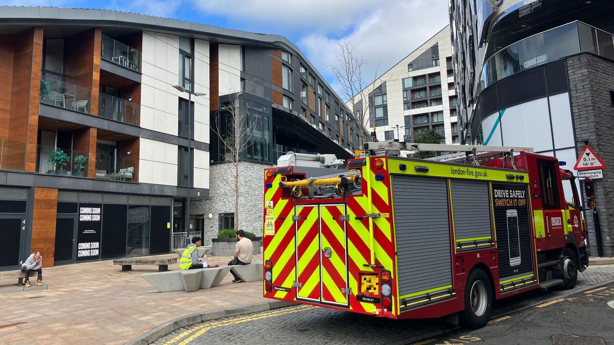 London Fire Brigade engine parked outside a block of flats