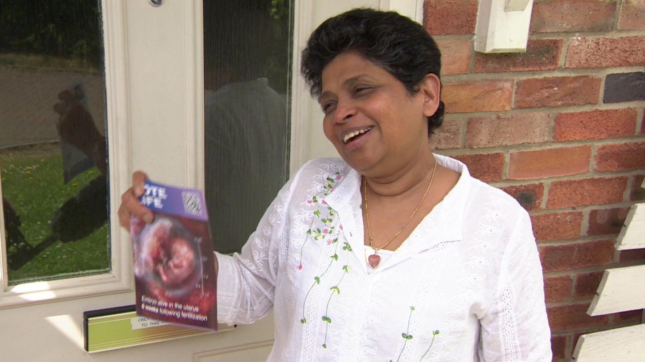 Priyanka holding an anti-abortion leaflet in Kingswood, Hull