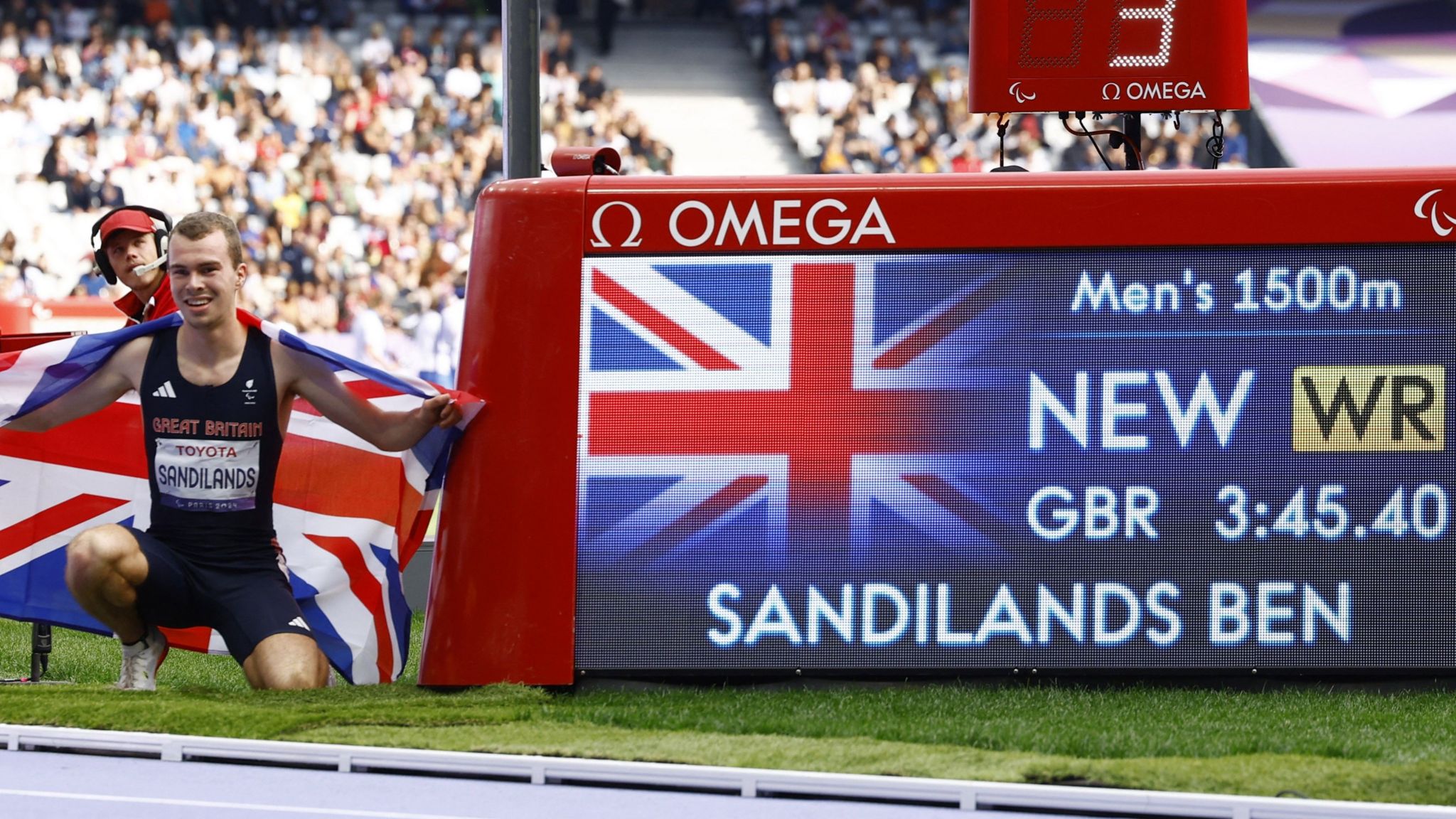 Ben Sandilands poses next to his world-record time