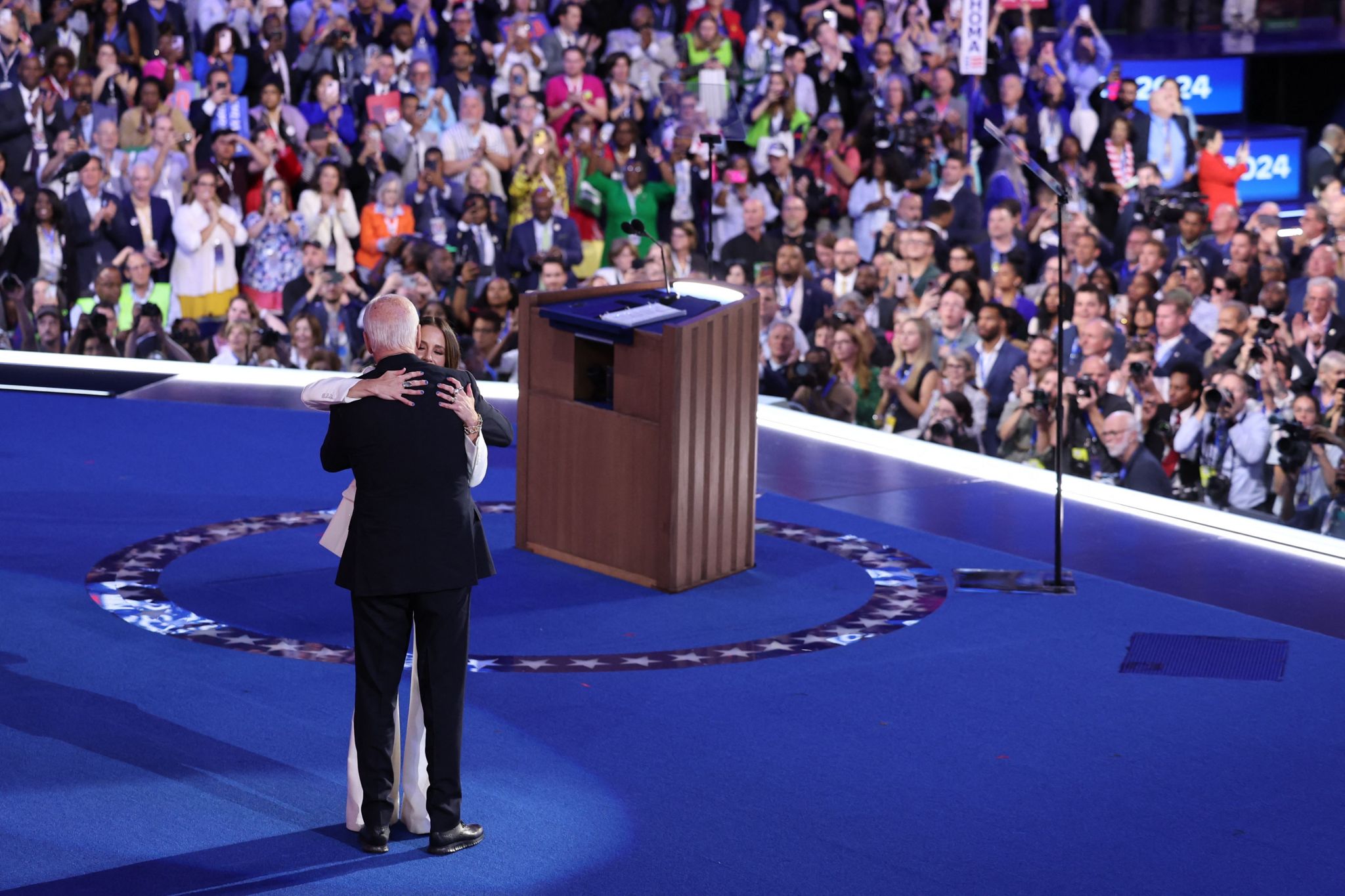 U.S. President Joe Biden embraces his daughter Ashley Biden on stage during Day one of the Democratic National Convention (DNC) in Chicago