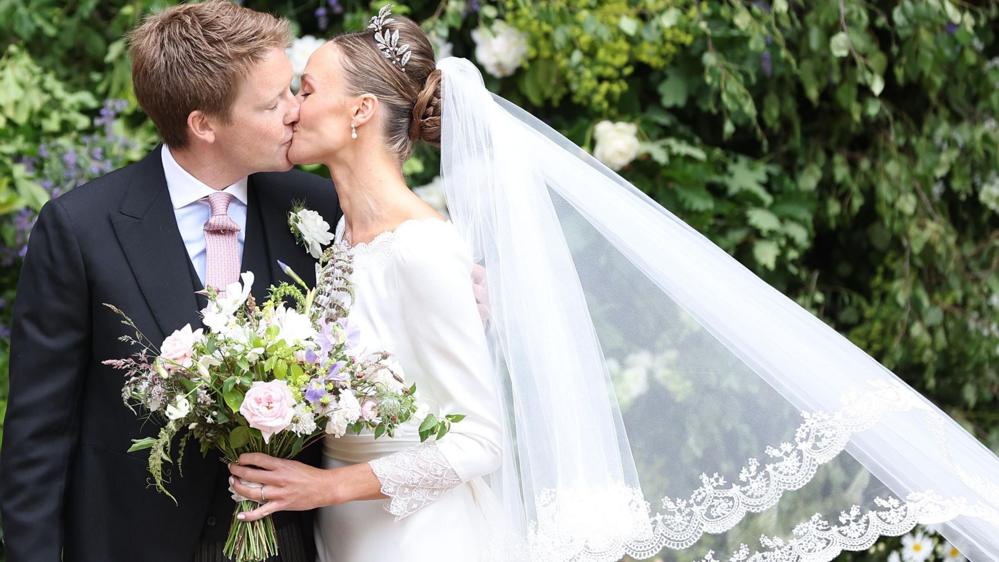 Billionaire aristocrat Hugh Grosvenor kisses his bride Olivia Henson