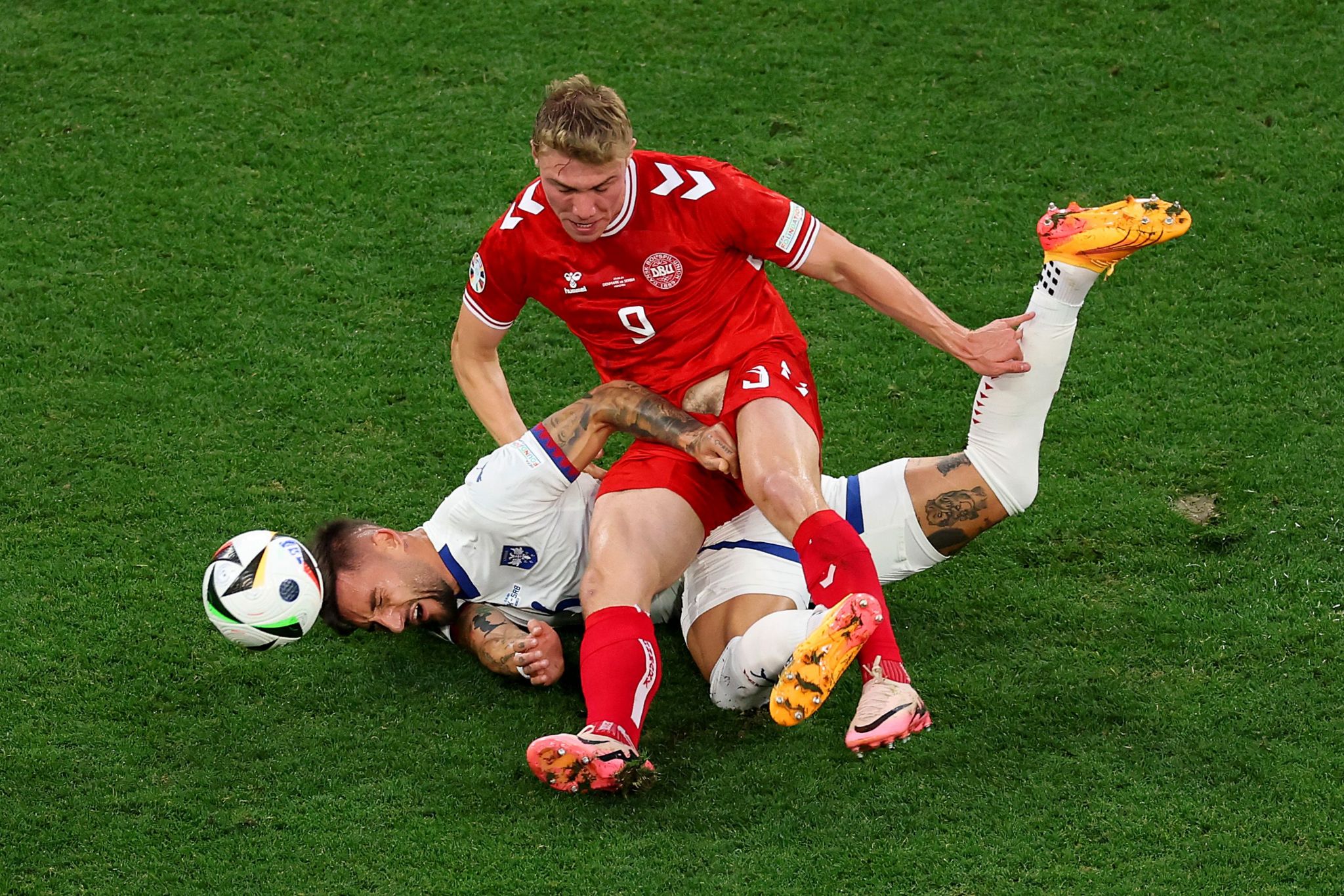 Denmark's Rasmus Hojlund and Nemanja Gudelj of Serbia battle for possession