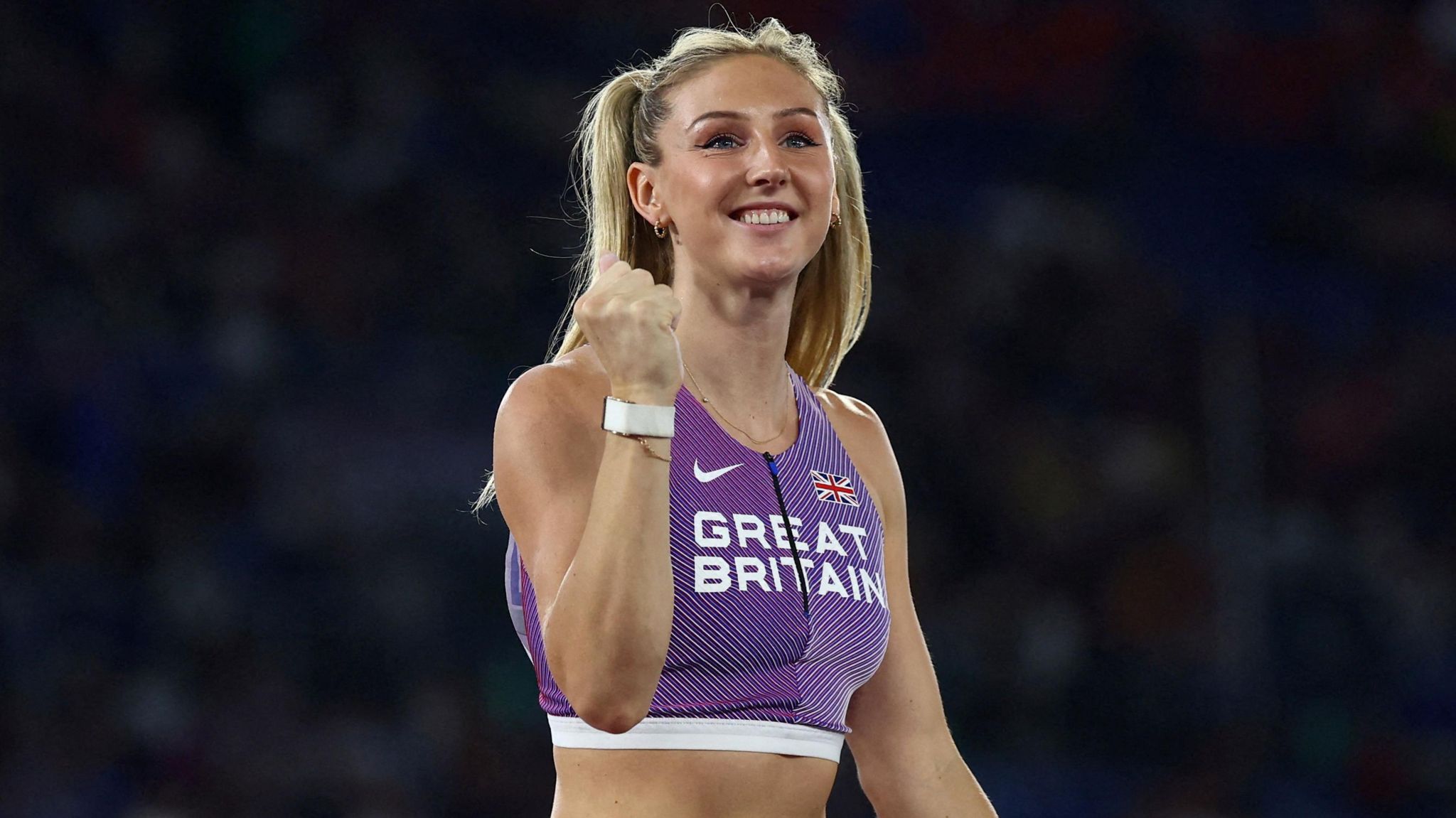 Molly Caudery celebrates with a clenched fist while competing for Great Britain