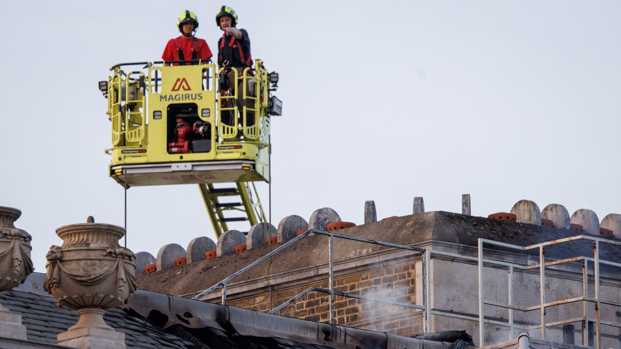 Firefighters look over Somerset House after tackling the blaze.