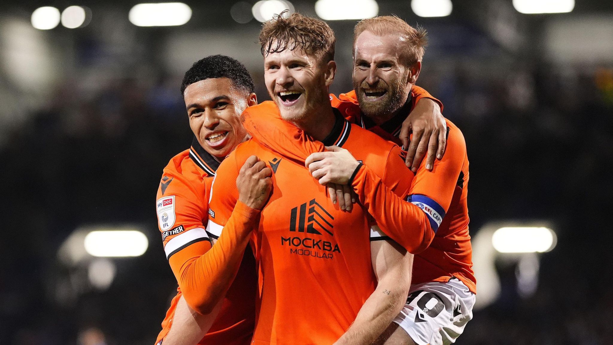 Michael Smith celebrates with his team-mates after scoring for Sheffield Wednesday against Portsmouth