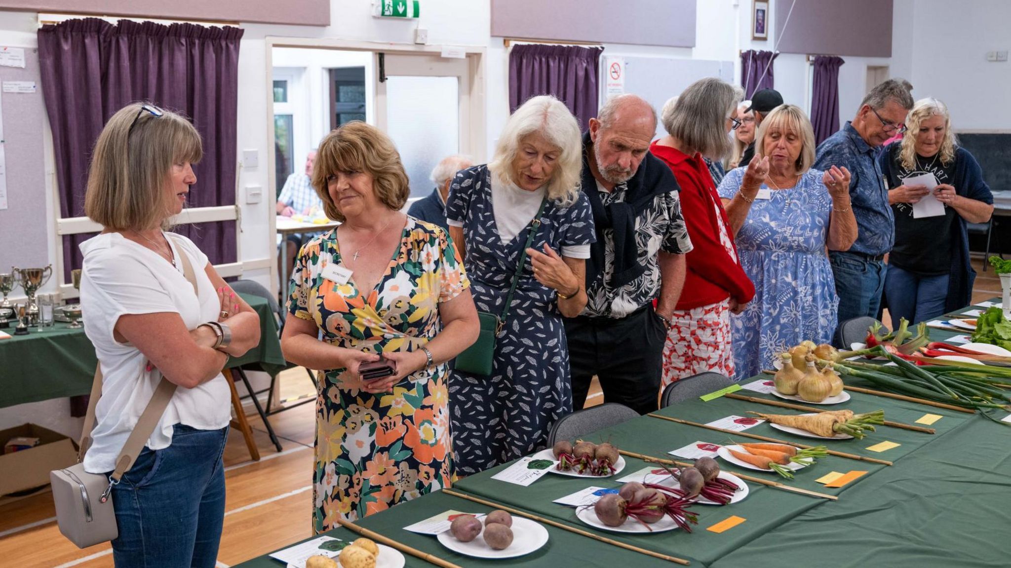 People examine the produce on show