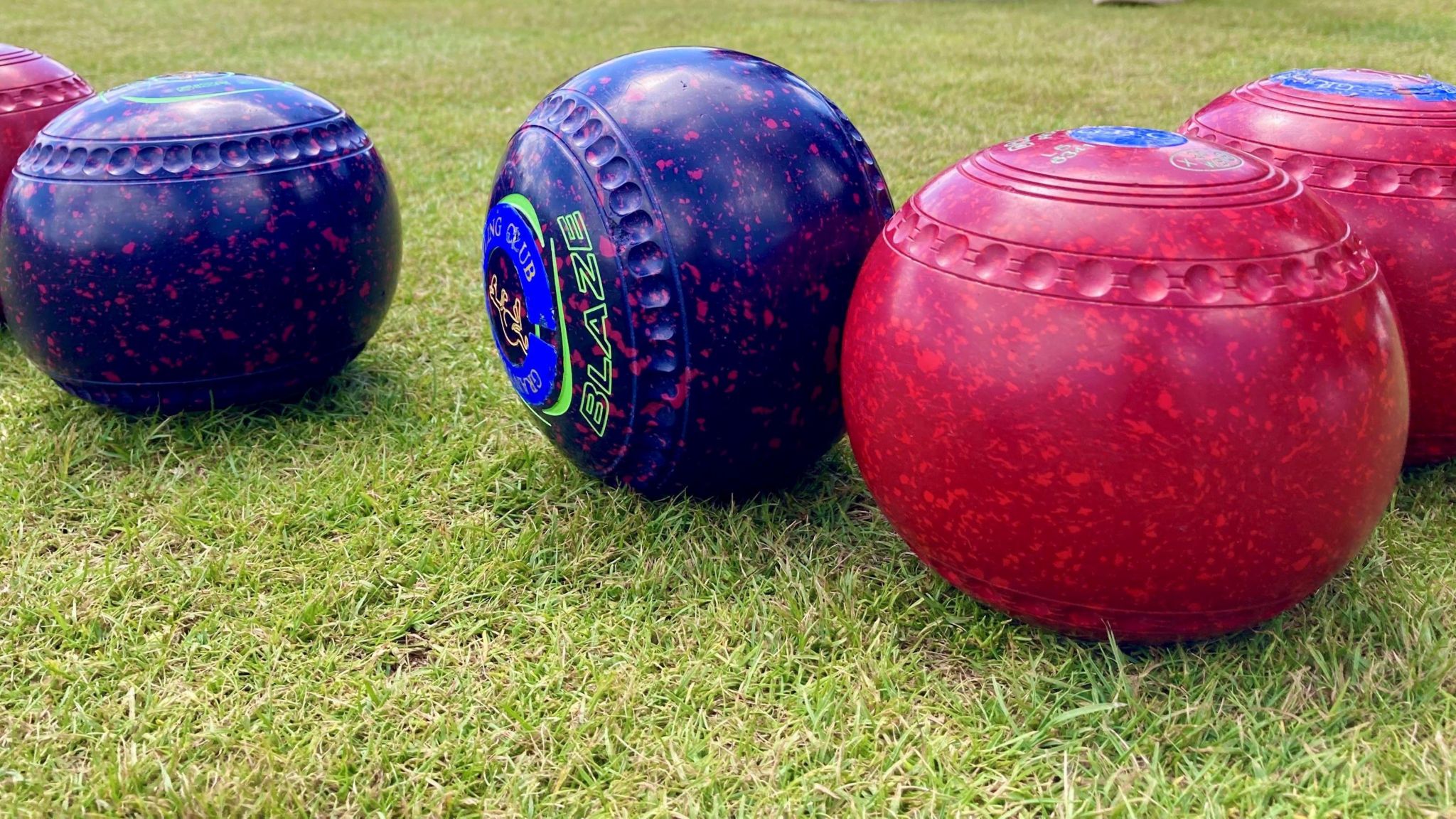 A close-up photograph of some bowling balls