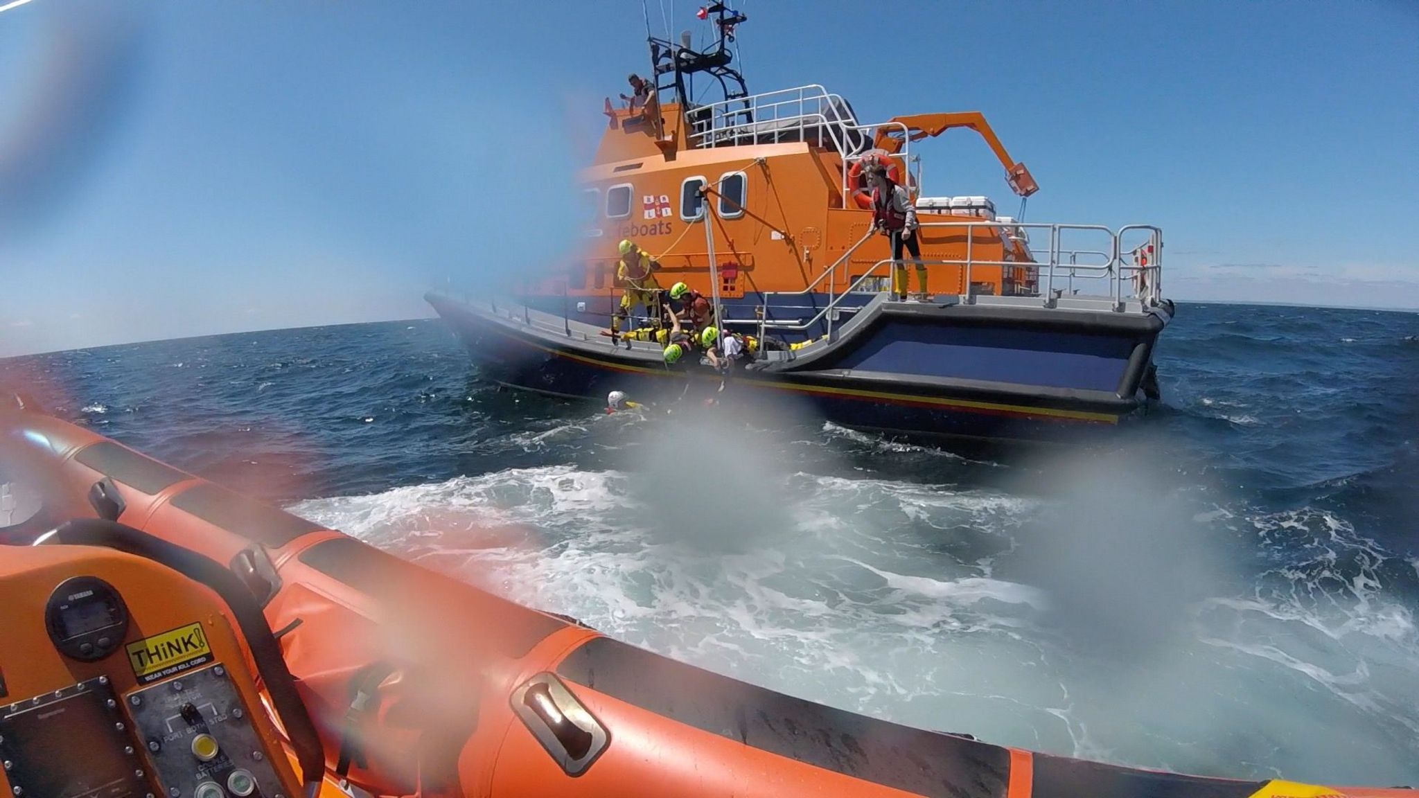 RNLI rescuing diver near the Eddystone Lighthouse