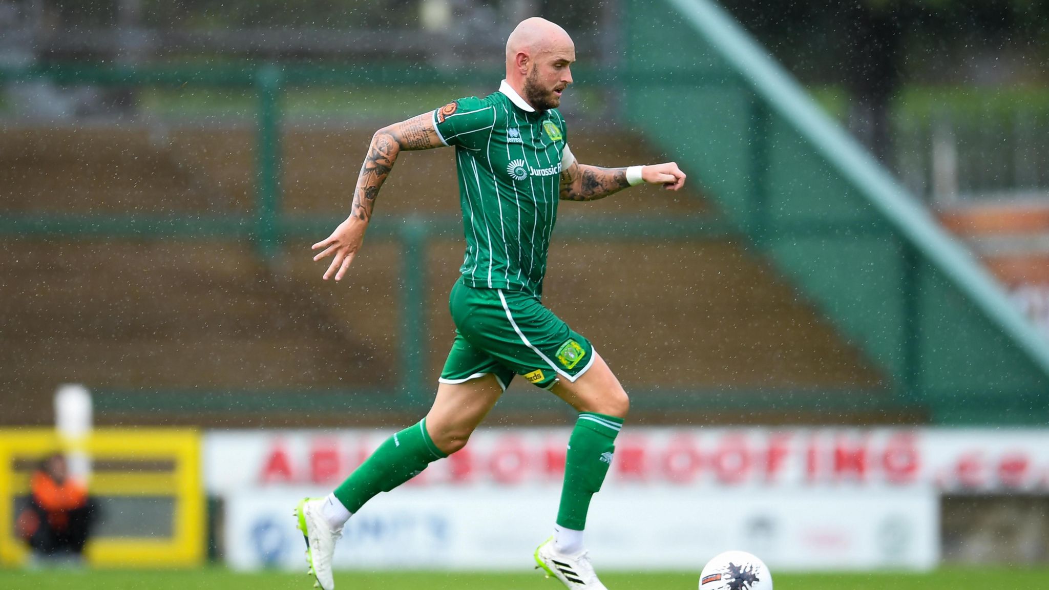 Josh Staunton running with the ball during a game for Yeovil