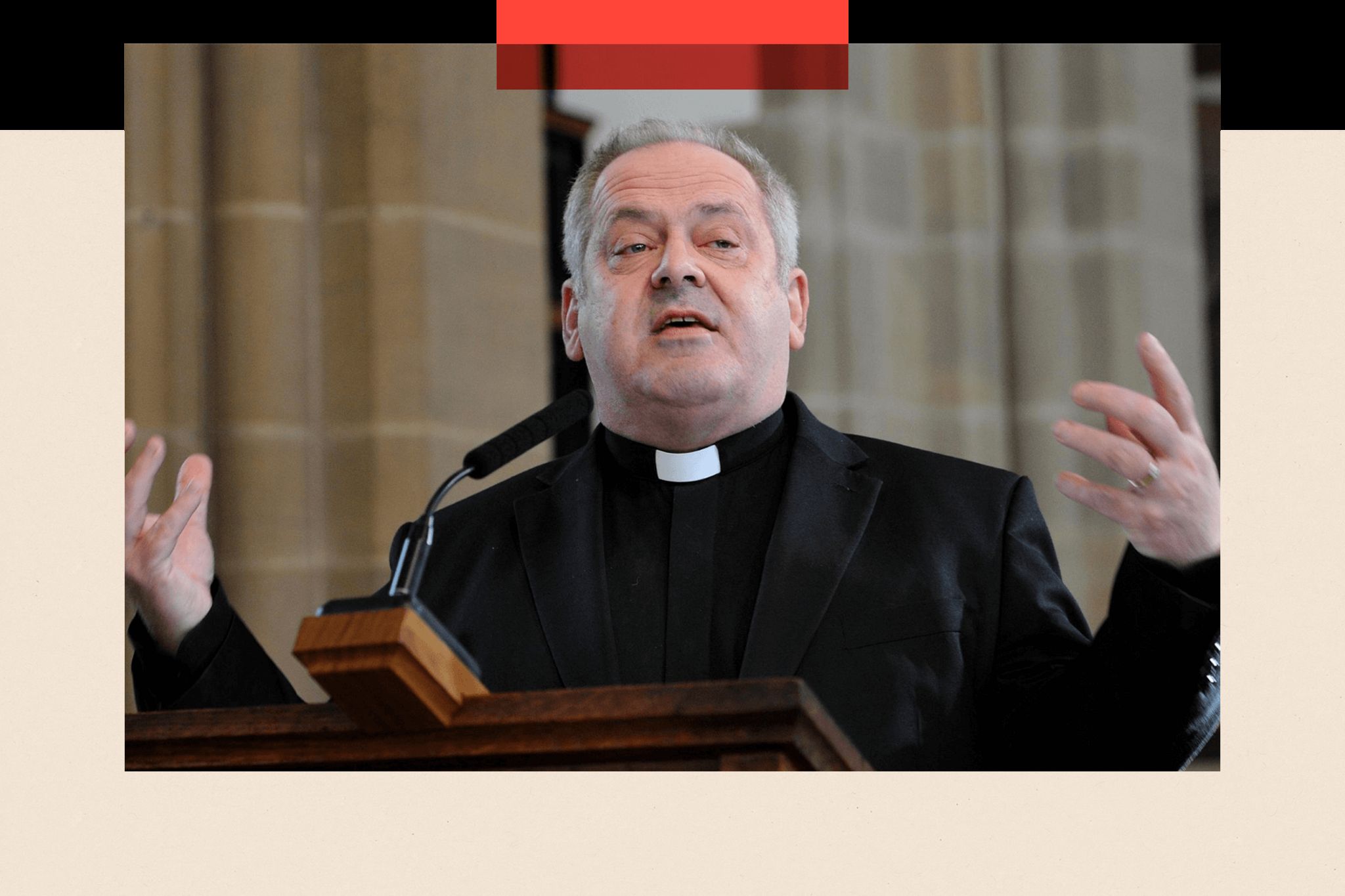 Andrew Hindley speaks from a pulpit